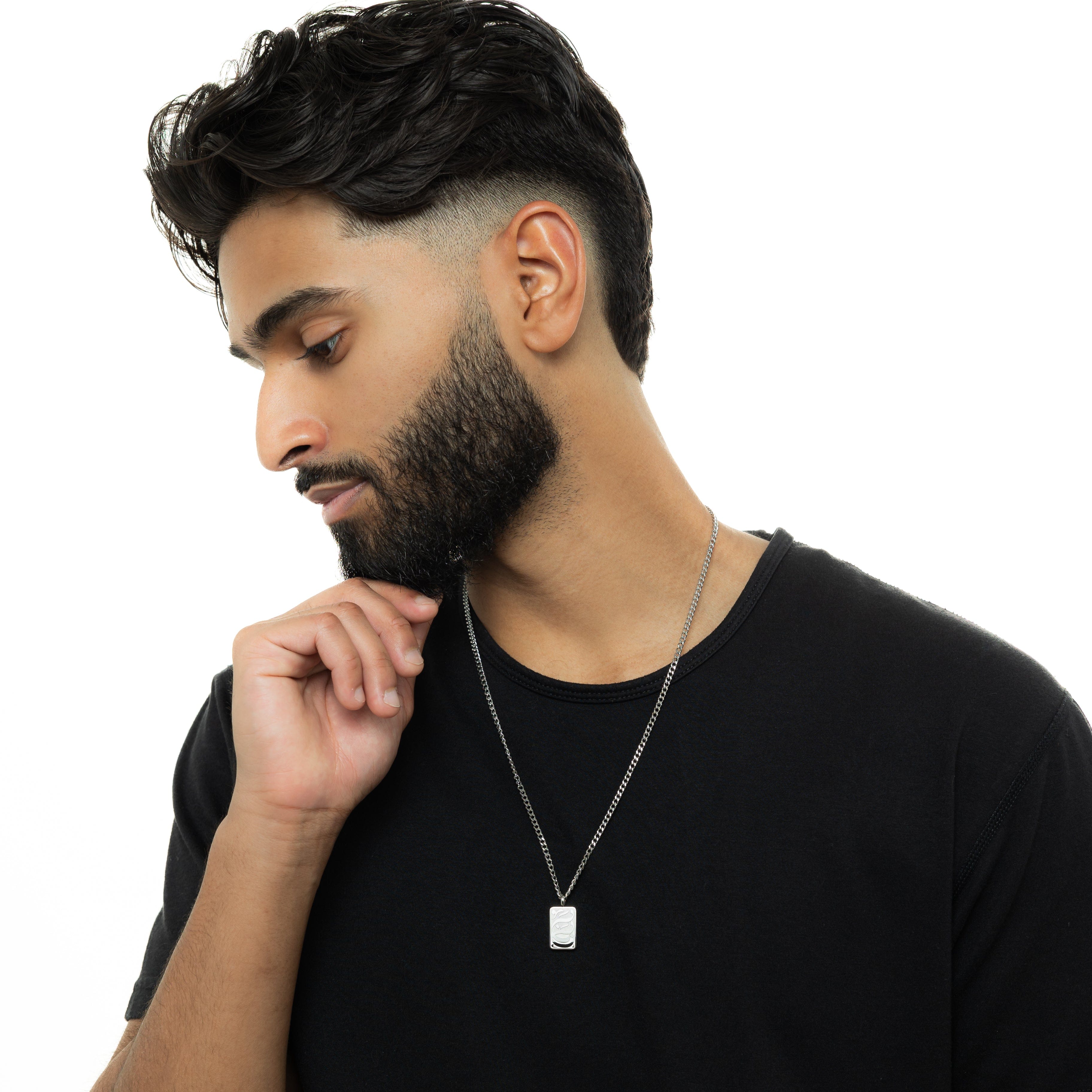 Man wearing the Baba engraved tag necklace, highlighting its stylish design.