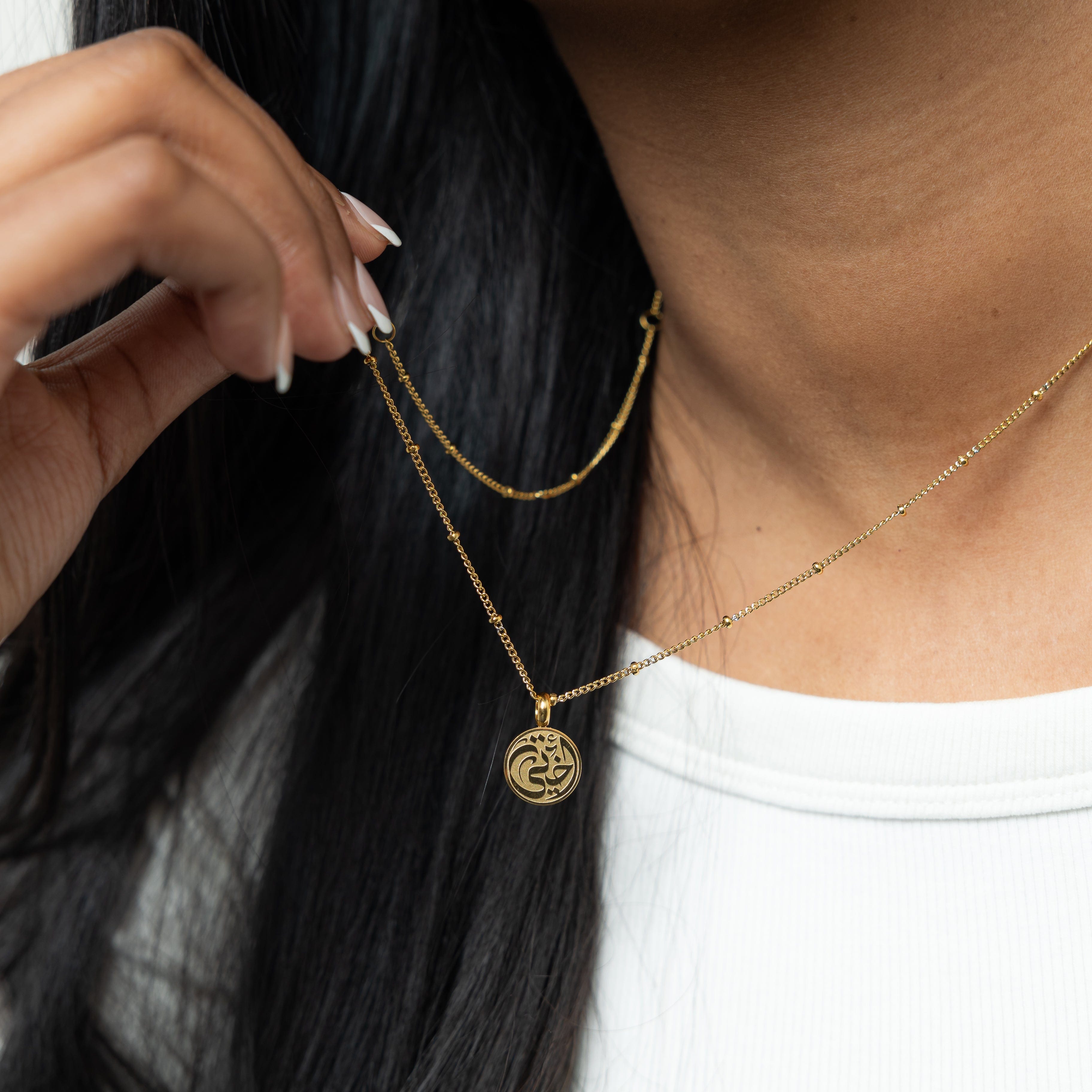 Model wearing the dainty necklace for women, showcasing pendant placement at full 22-inch length