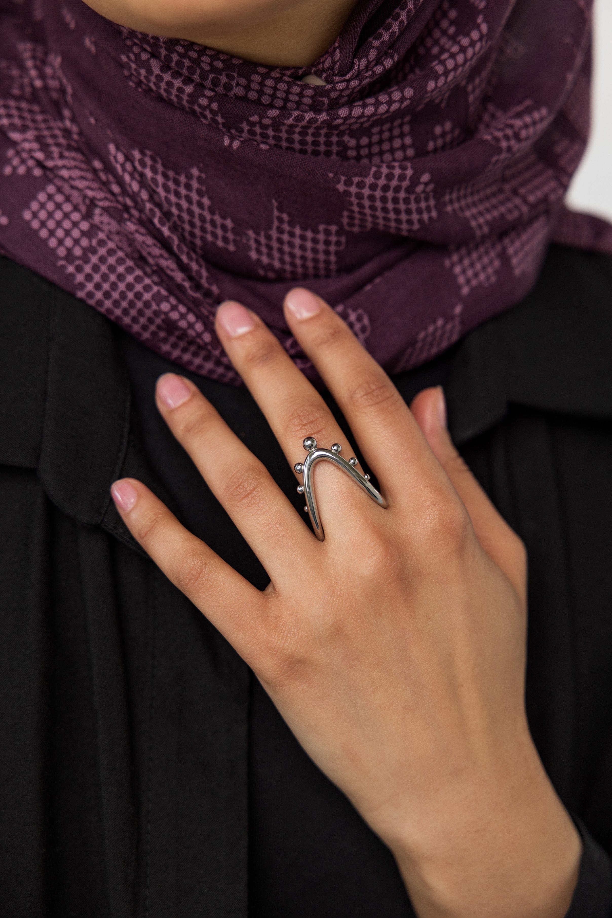 Side view of the Celestial Harmony Ring, displaying its elegant curvature.