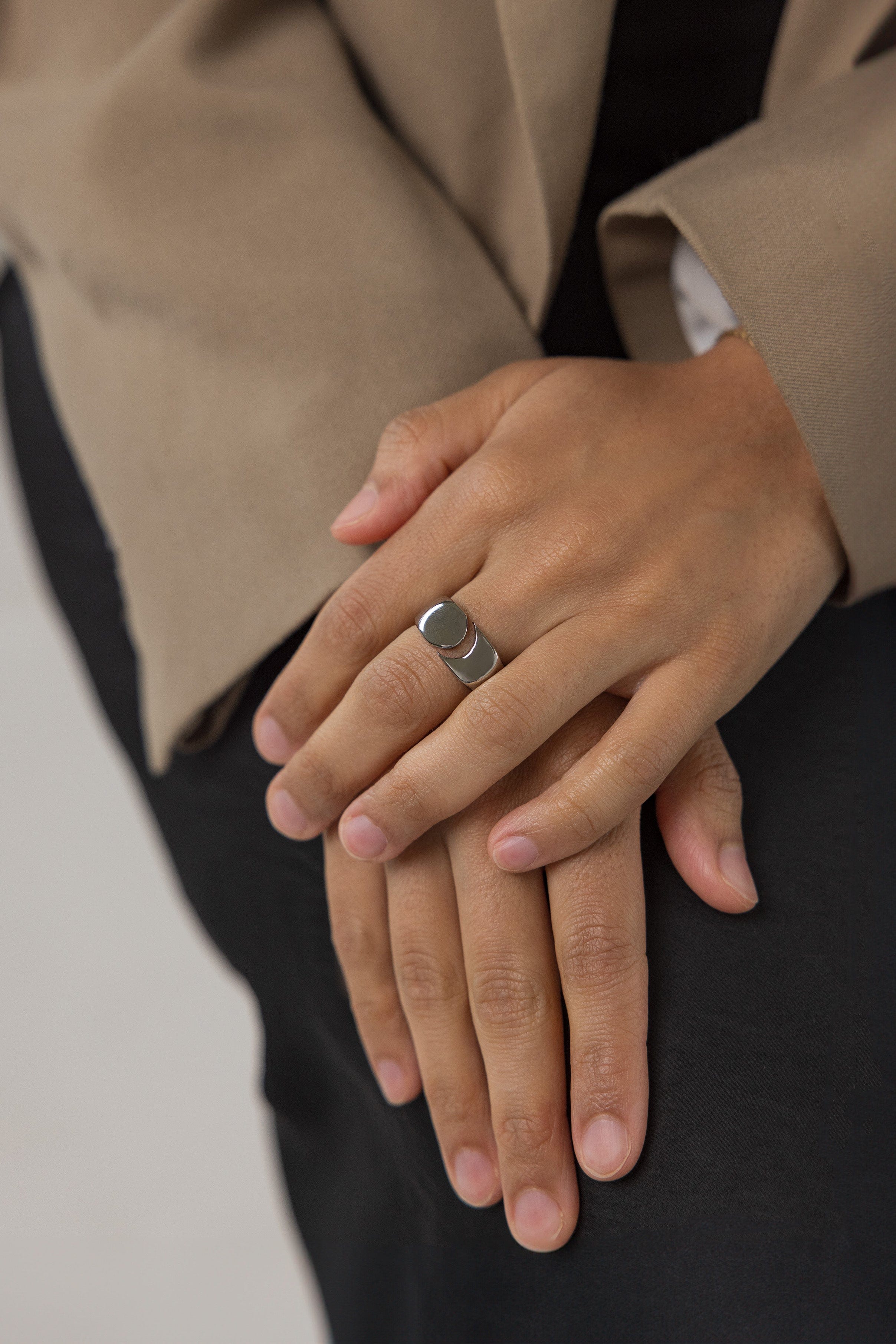 Lifestyle photo of the gold ring worn on finger, highlighting cosmic elegance