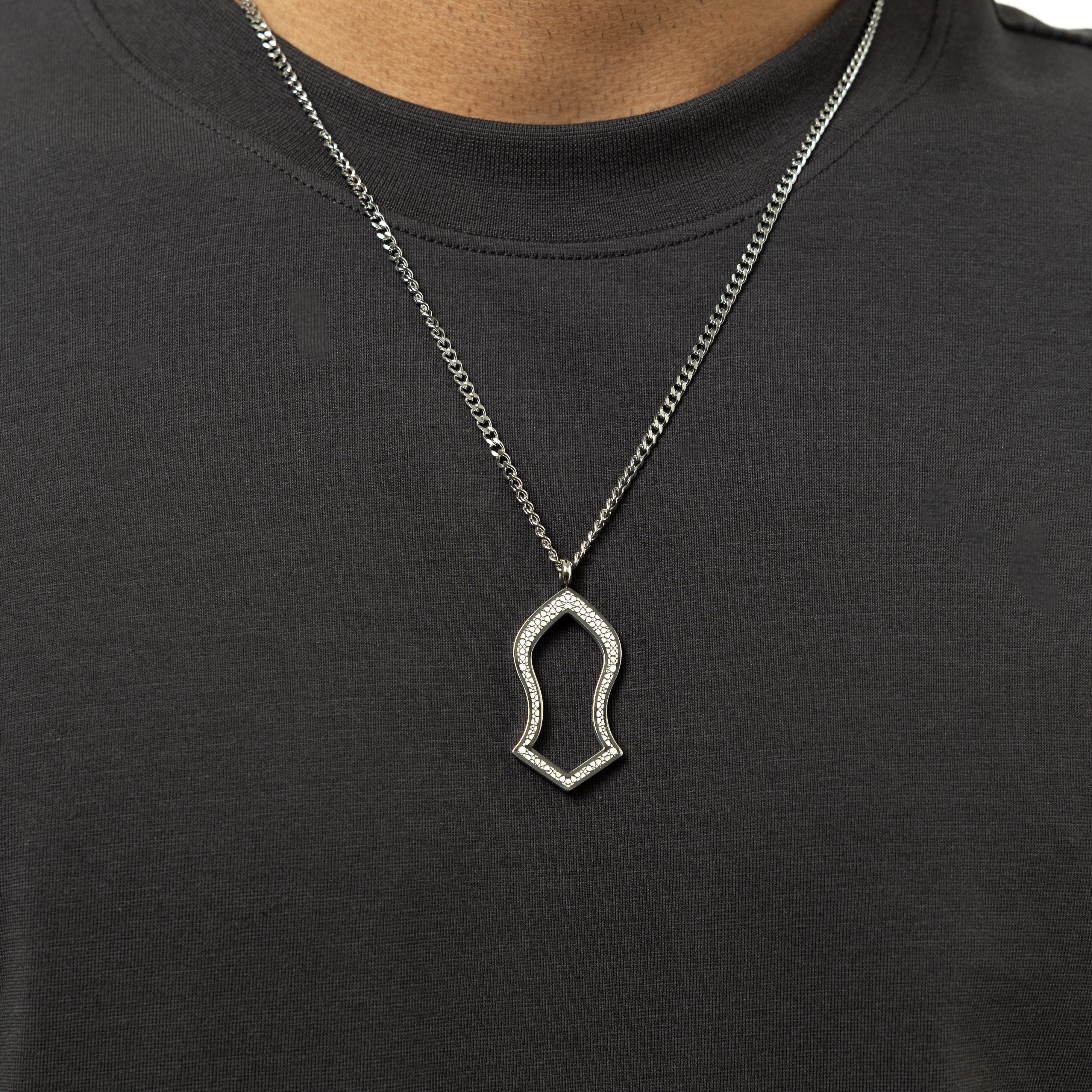 Man wearing the Prophets Sandal Necklace, highlighting its elegant style and fit.