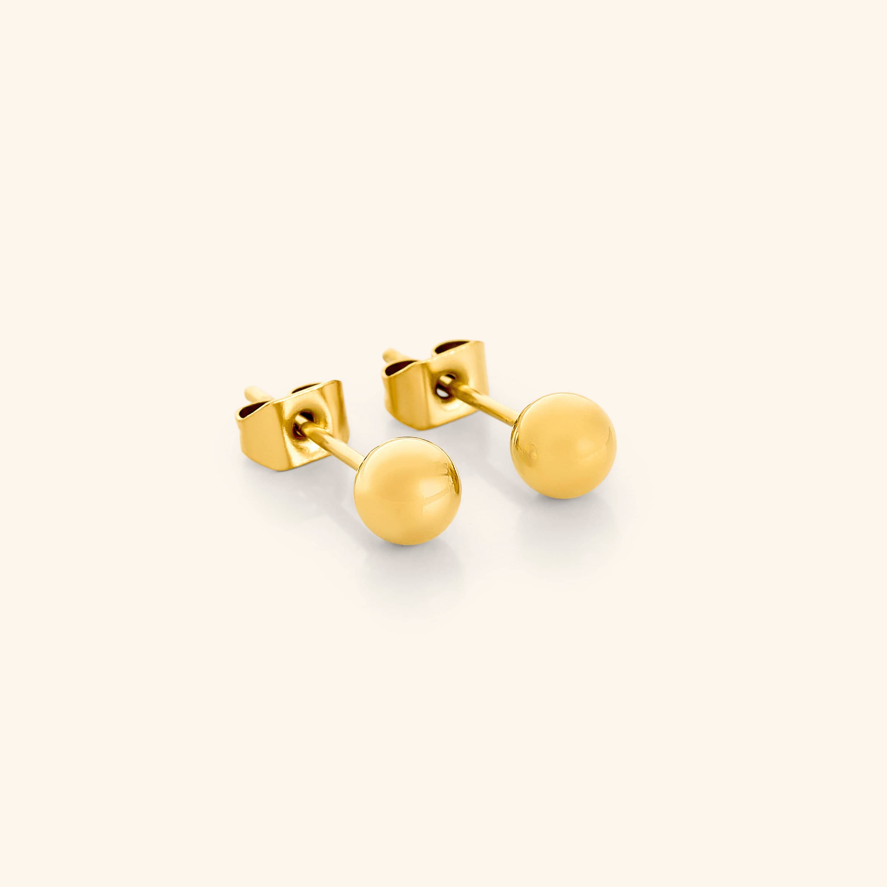 Close-up view of Elegant Minimalist Gold Orb Stud Earrings showcasing their shine