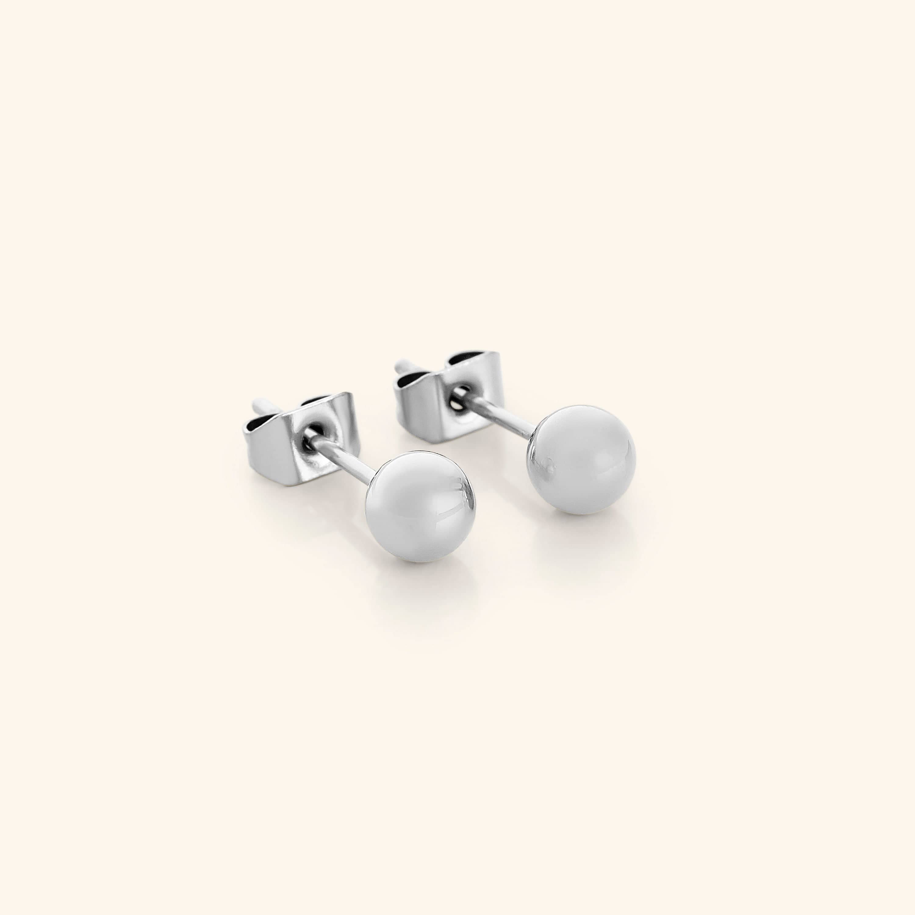 Close-up view of Elegant Minimalist Gold Orb Stud Earrings showcasing their shine