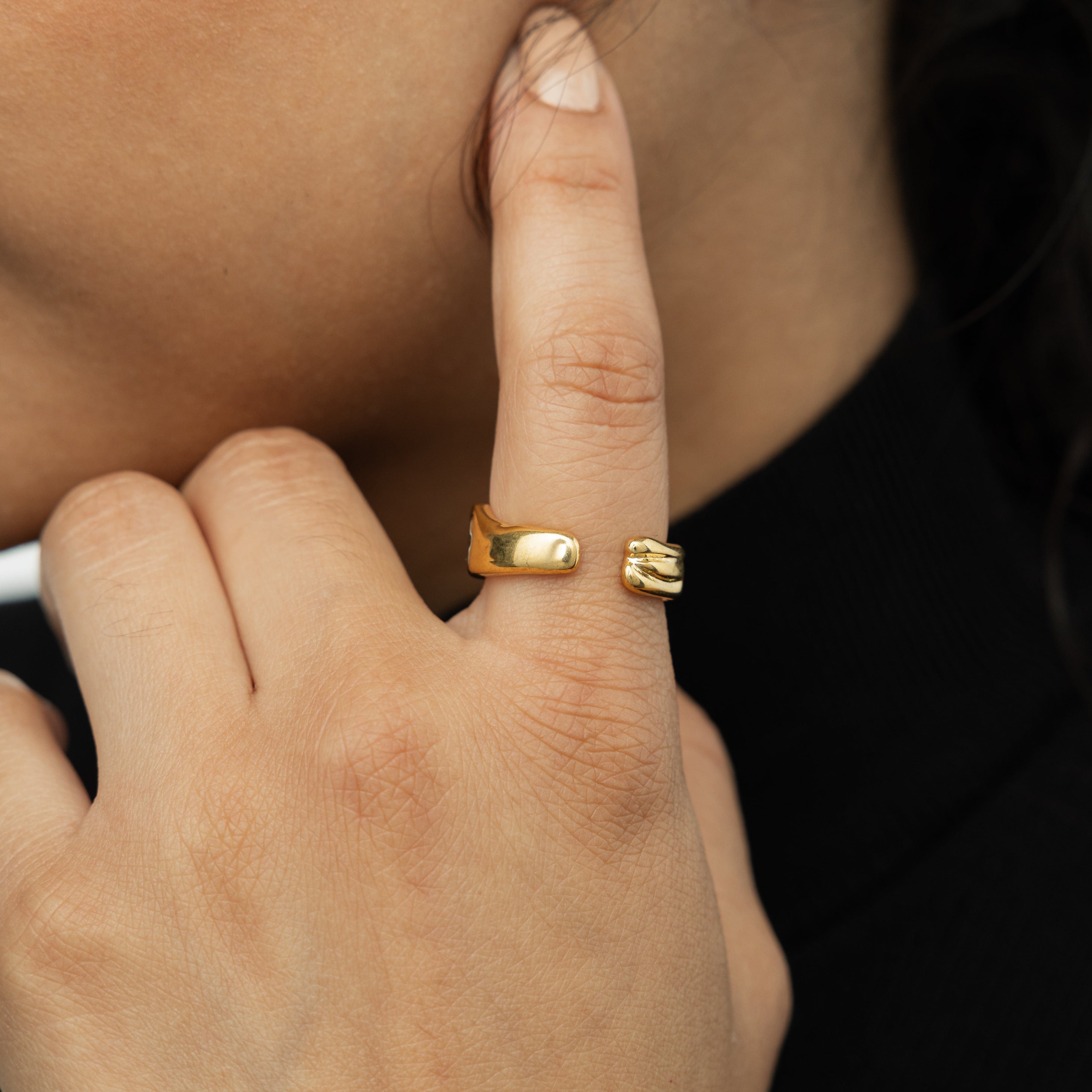 Close-up of the Fluid Molten Gold Ring highlighting the intricate design and smooth finish.