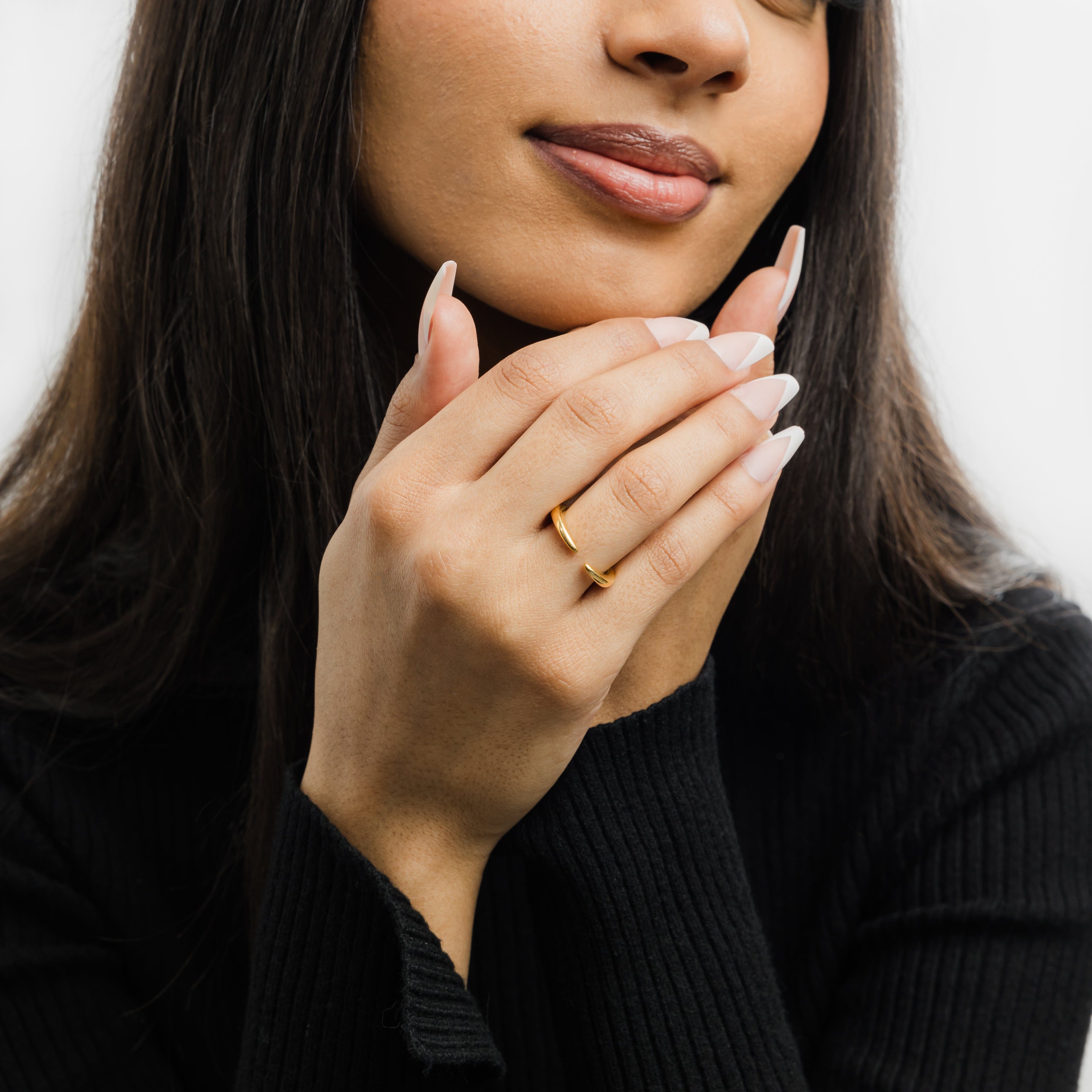 Stacked view of the open gap gold ring paired with other stackable rings.