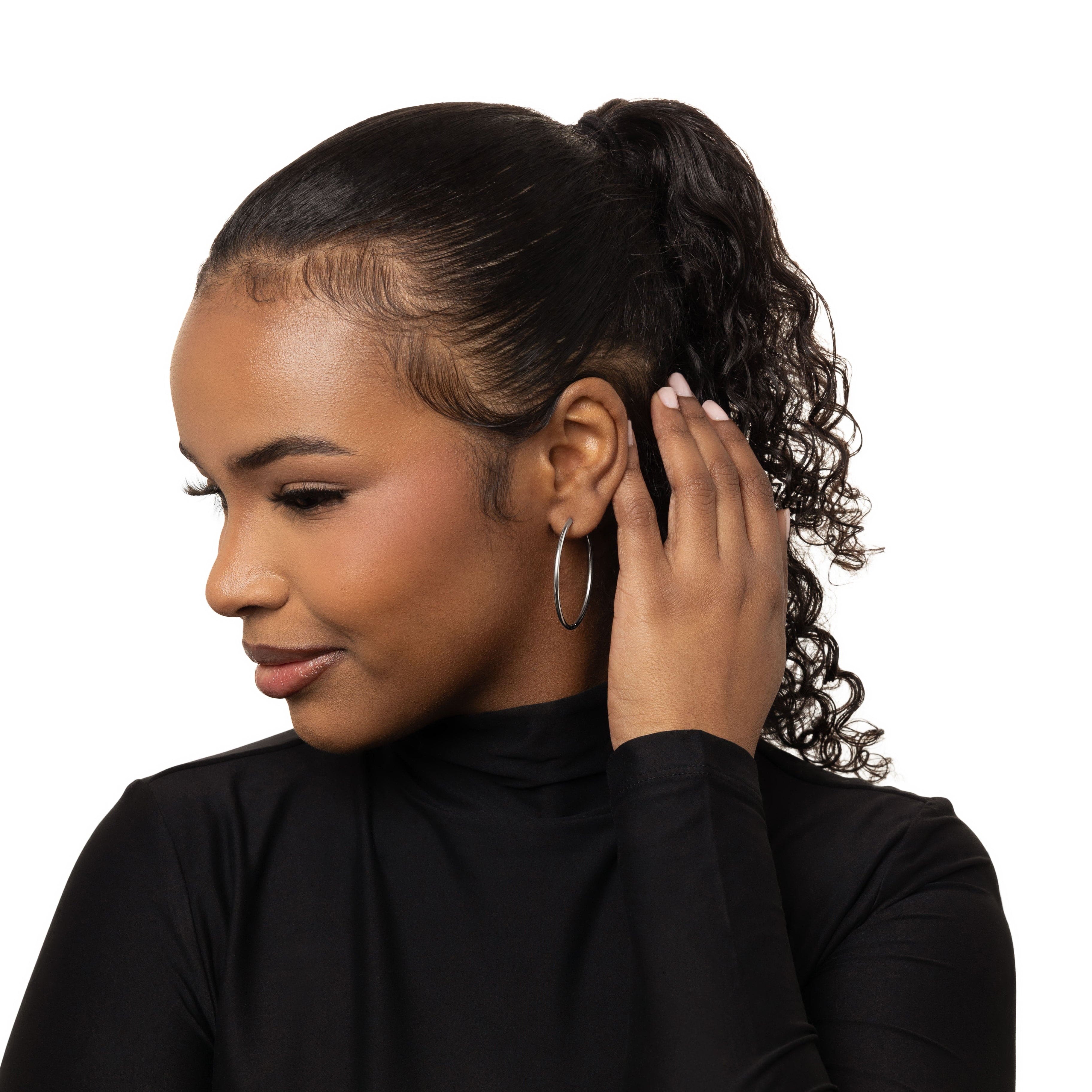 Model wearing lightweight gold hoop earrings for a casual day out.