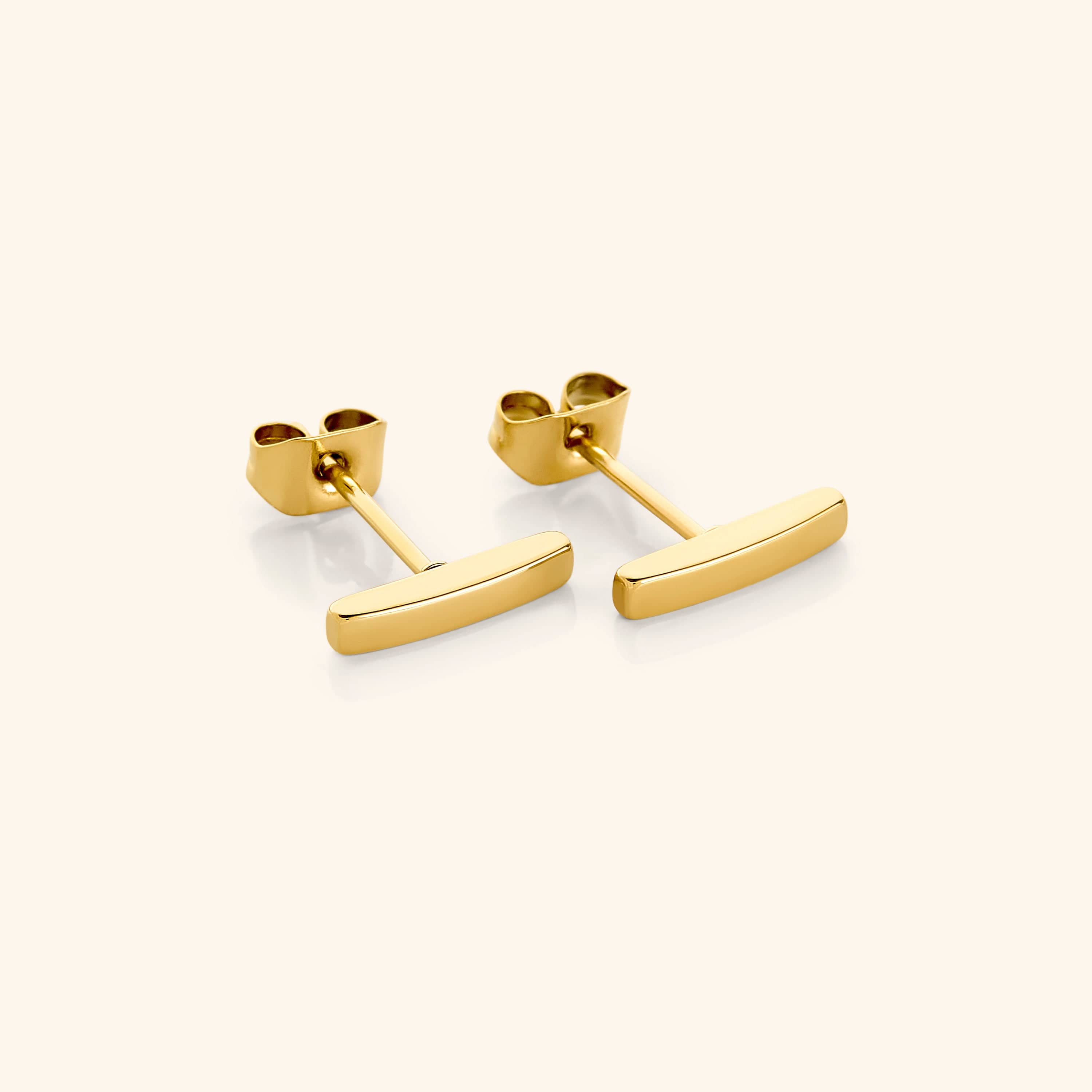 Close-up of Timeless Gold Pillar Stud Earrings showcasing their elegant design