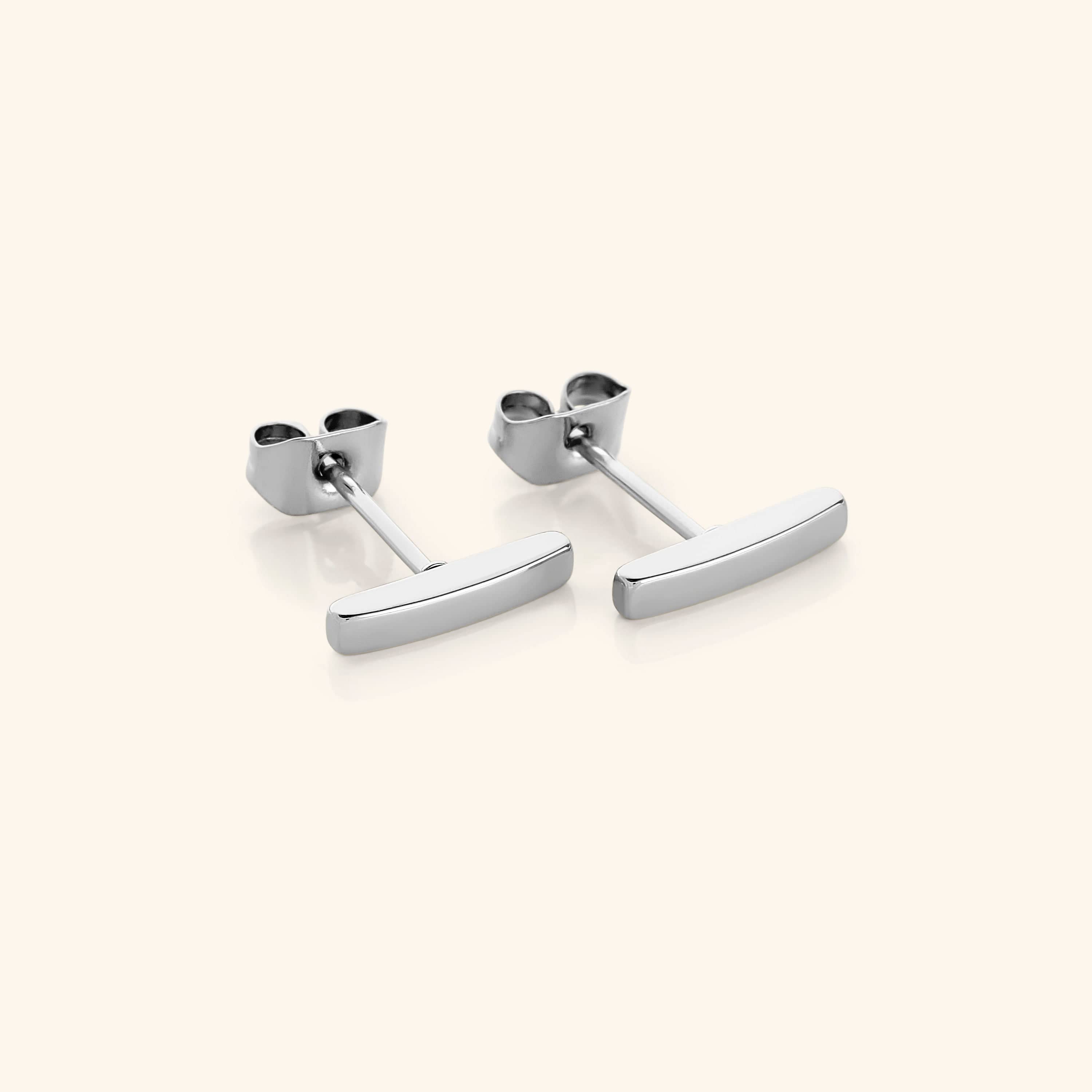 Model wearing lightweight stud earrings for sensitive ears in casual setting