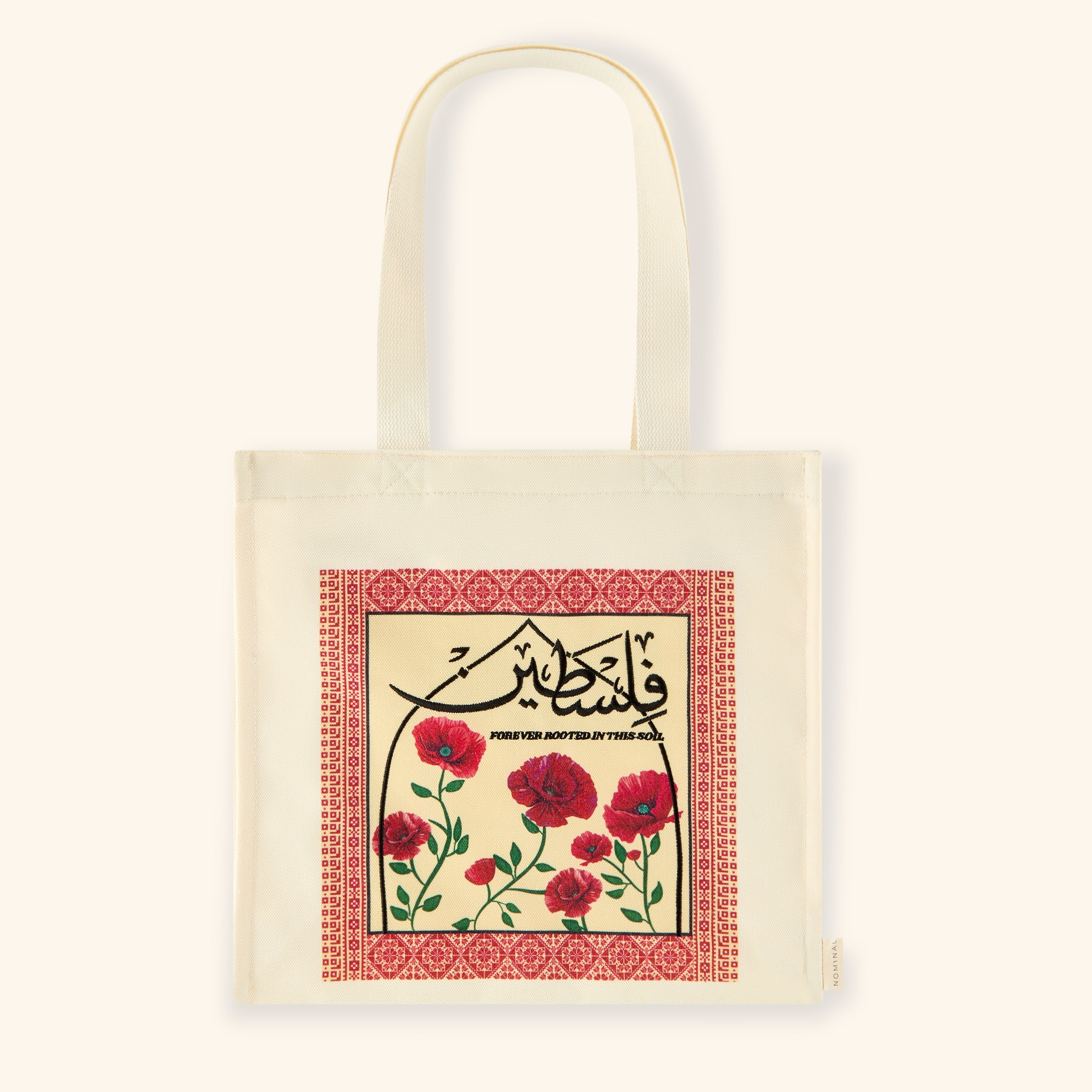 Heritage Bloom Arabic Calligraphy Tote from the front, highlighting the bold Arabic text and poppy design.