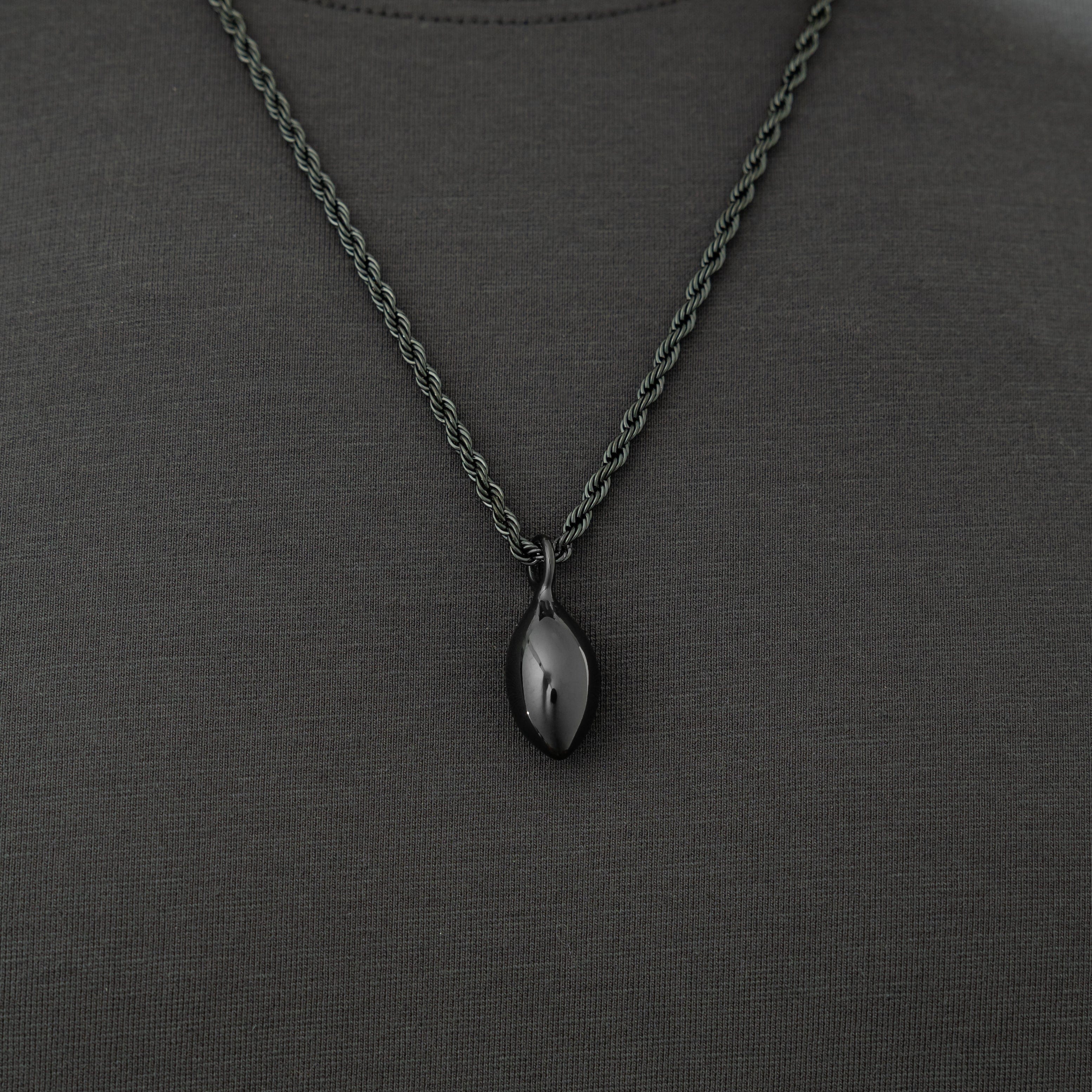 The premium stainless steel chain lying flat with pendant, emphasizing quality and everyday wear.