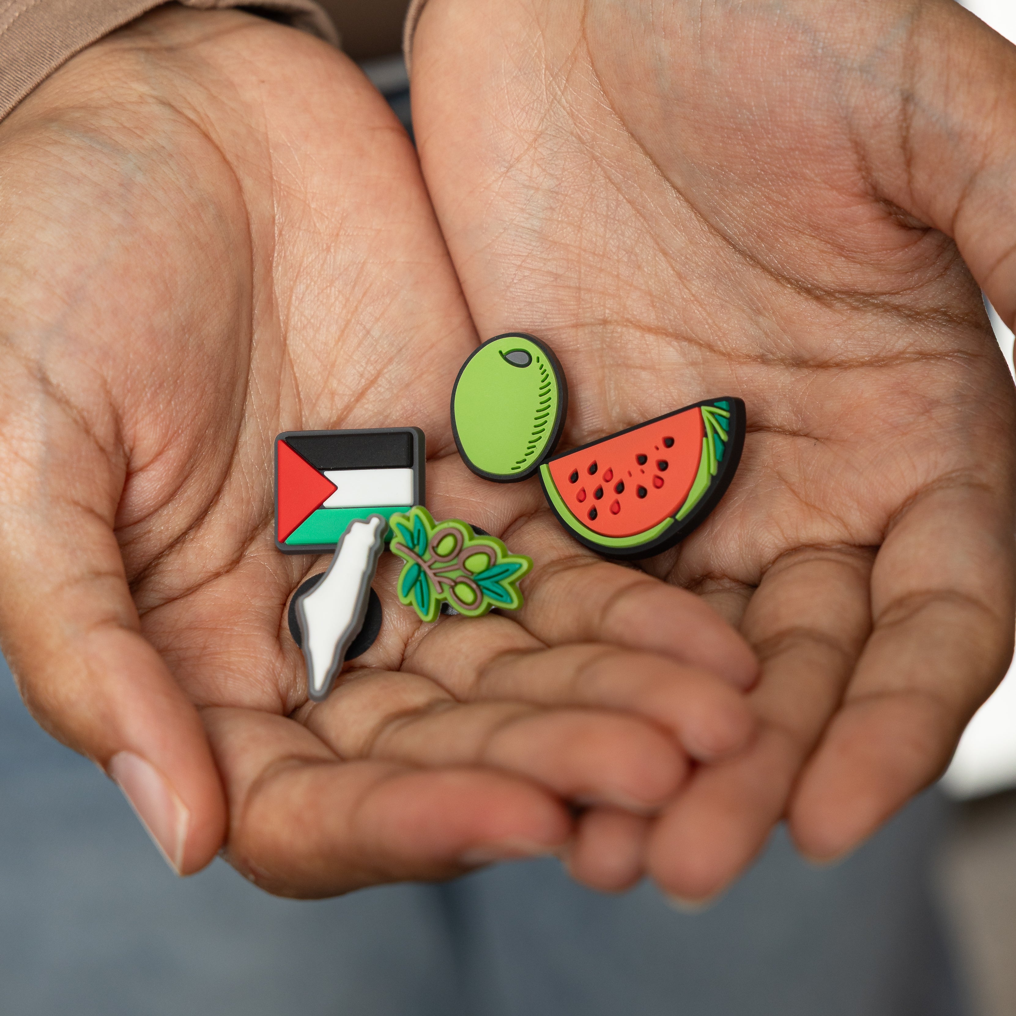 Map of Palestine charm, highlighting cultural identity.