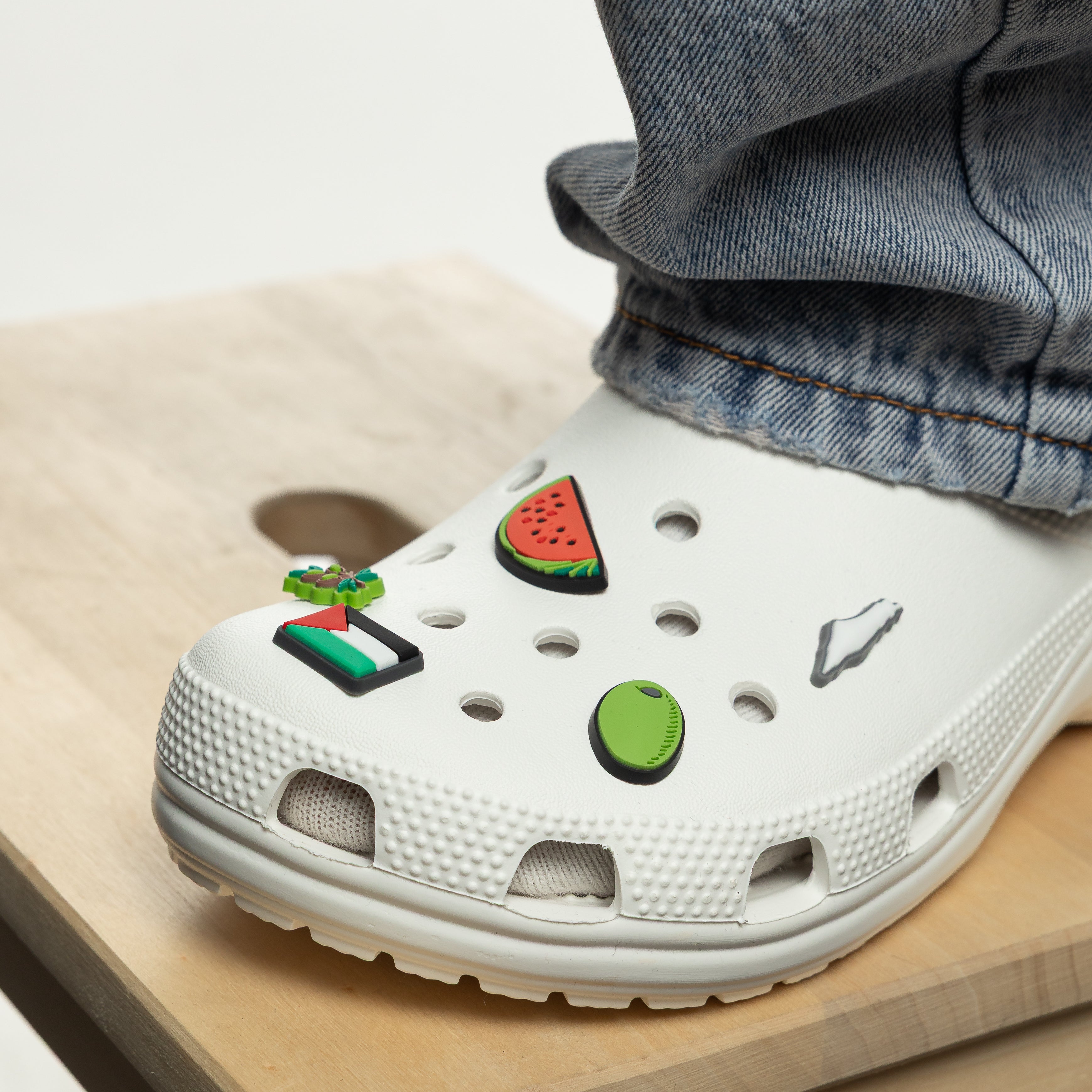 Close-up of the watermelon slice charm, a cultural icon.