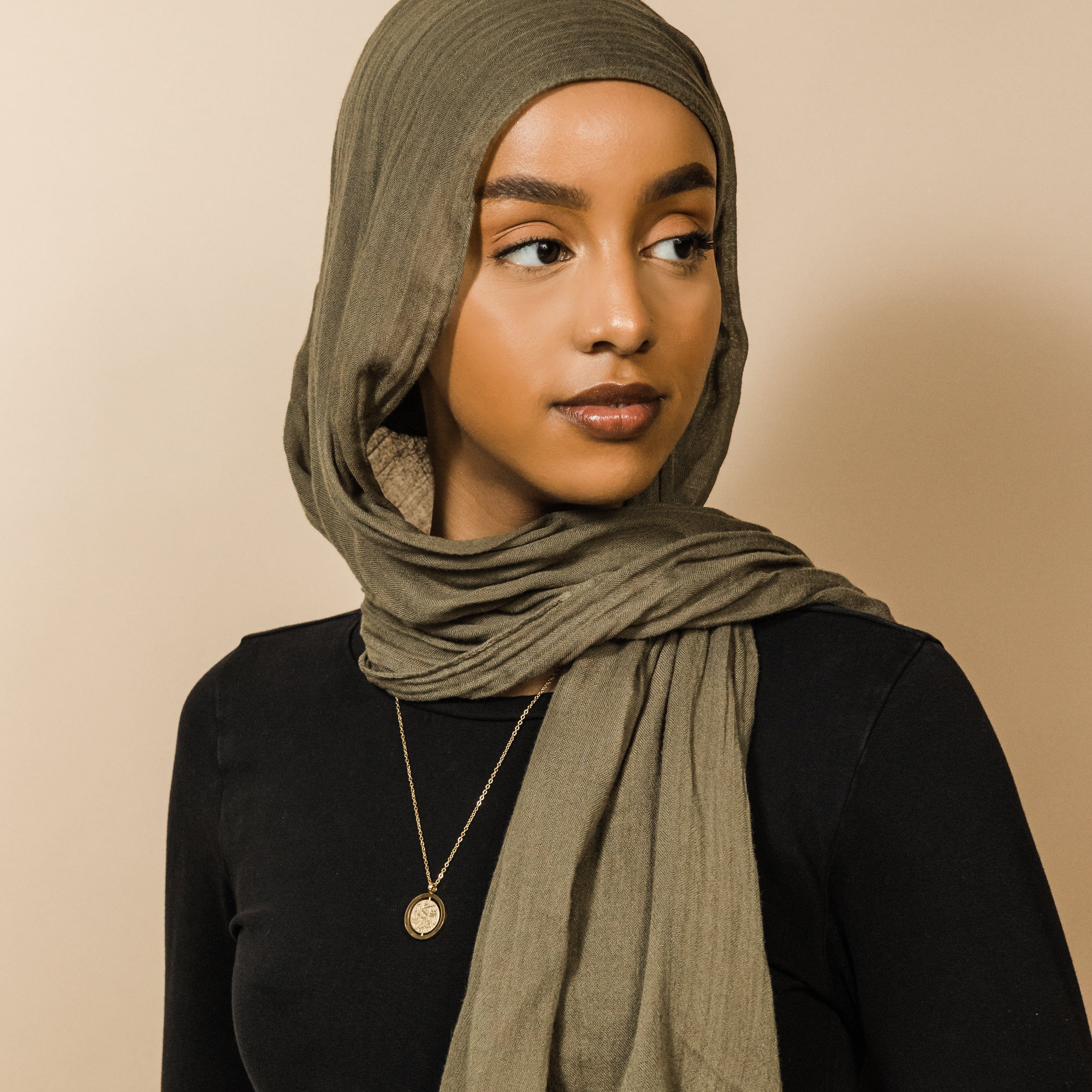 The Patience is Key necklace displayed in a velvet drawstring pouch, perfect for gifting.