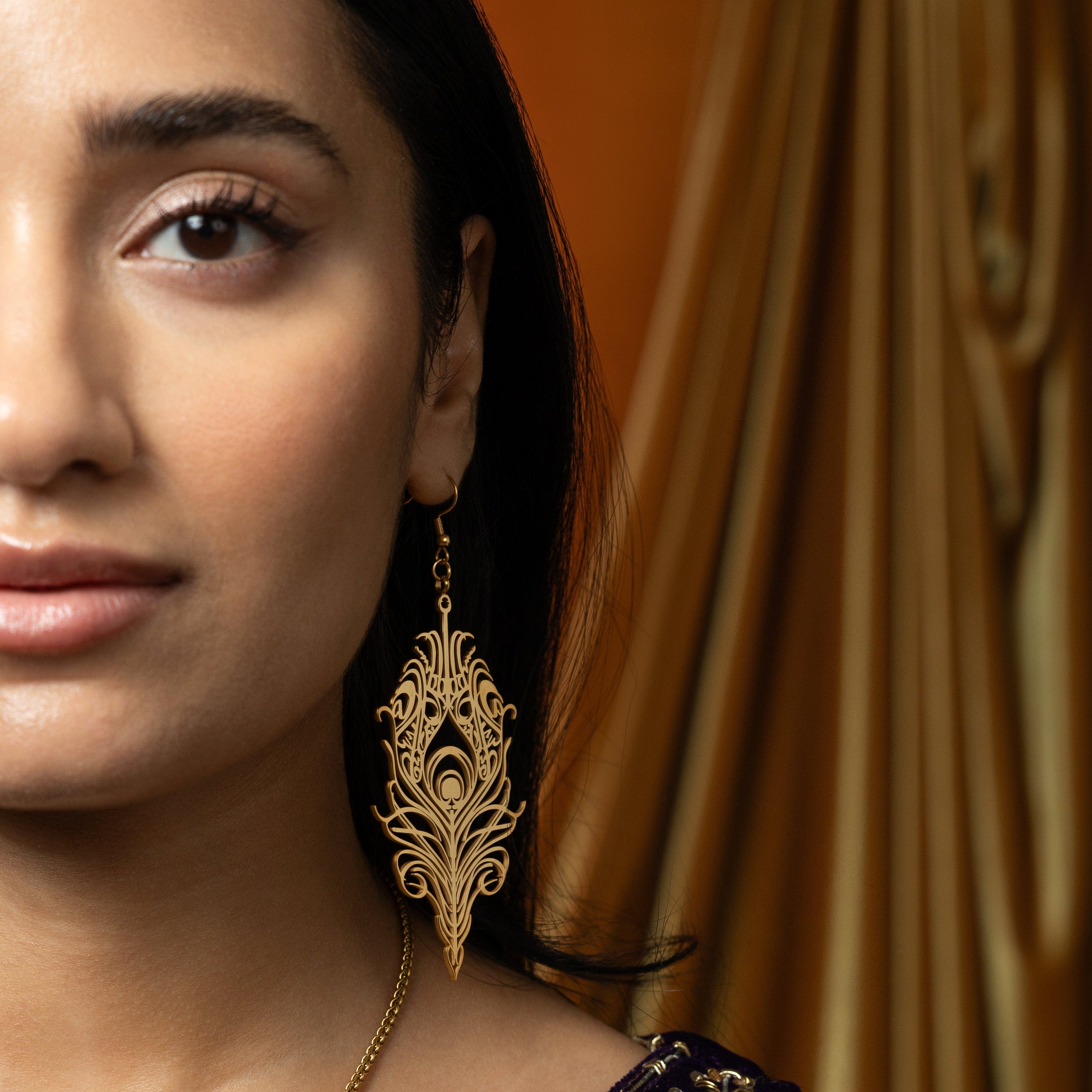 Eternal Bond earrings worn by a model, highlighting their elegant appeal and spiritual significance.