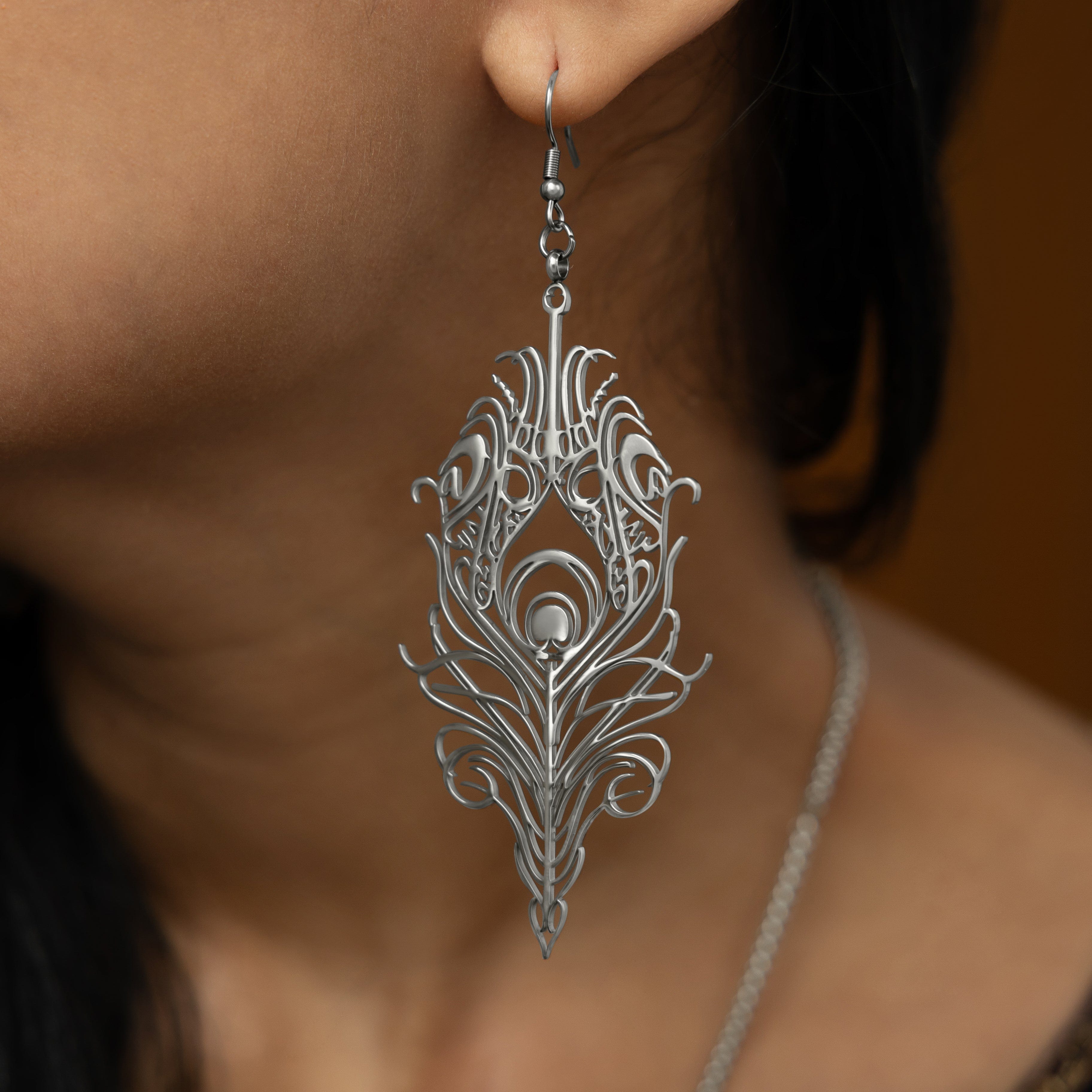 Eternal Bond earrings displayed in Nominal velvet pouch, emphasizing luxury and protection.