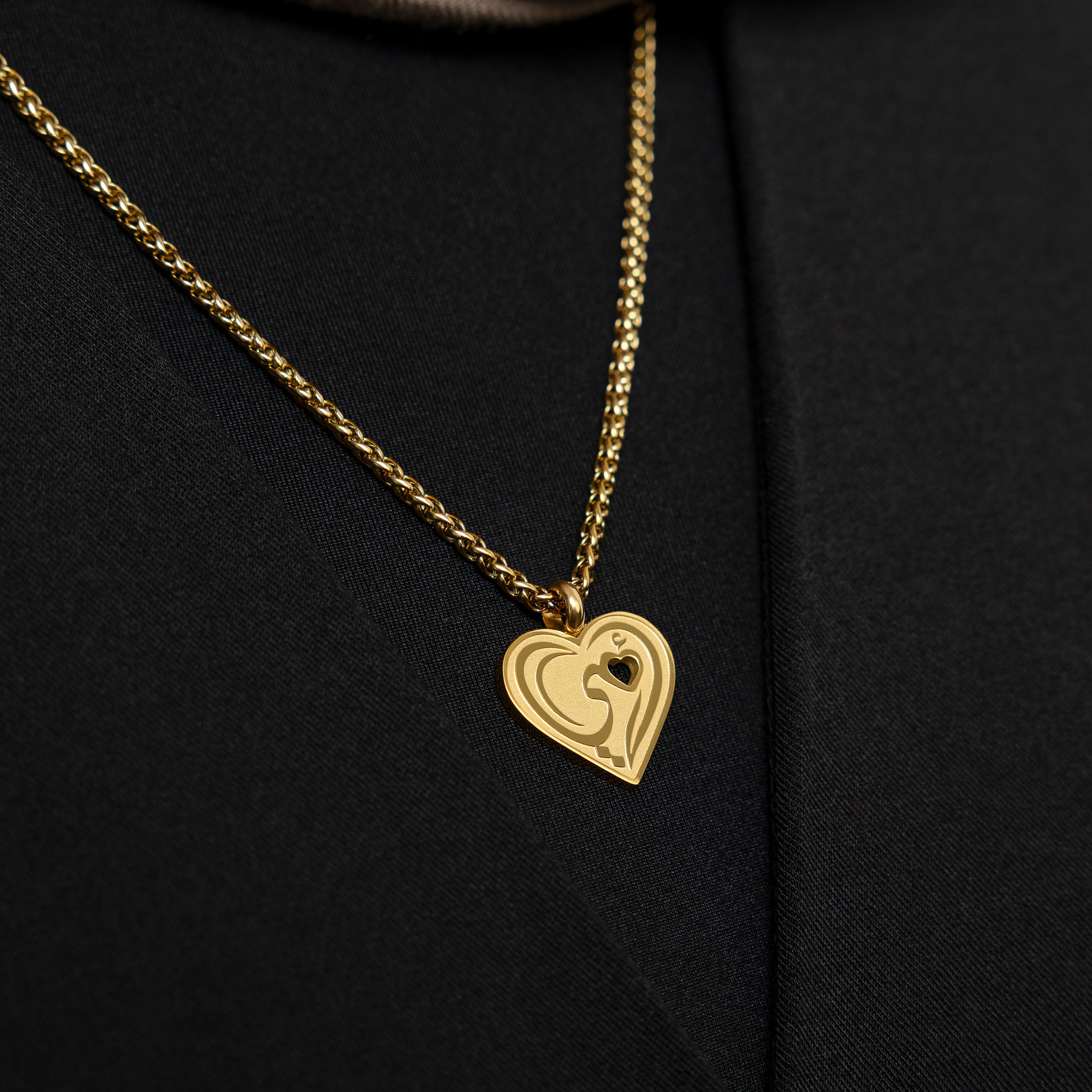 Close-up of the heart pendant on the Heartfelt Mama Necklace, highlighting the intricate design.