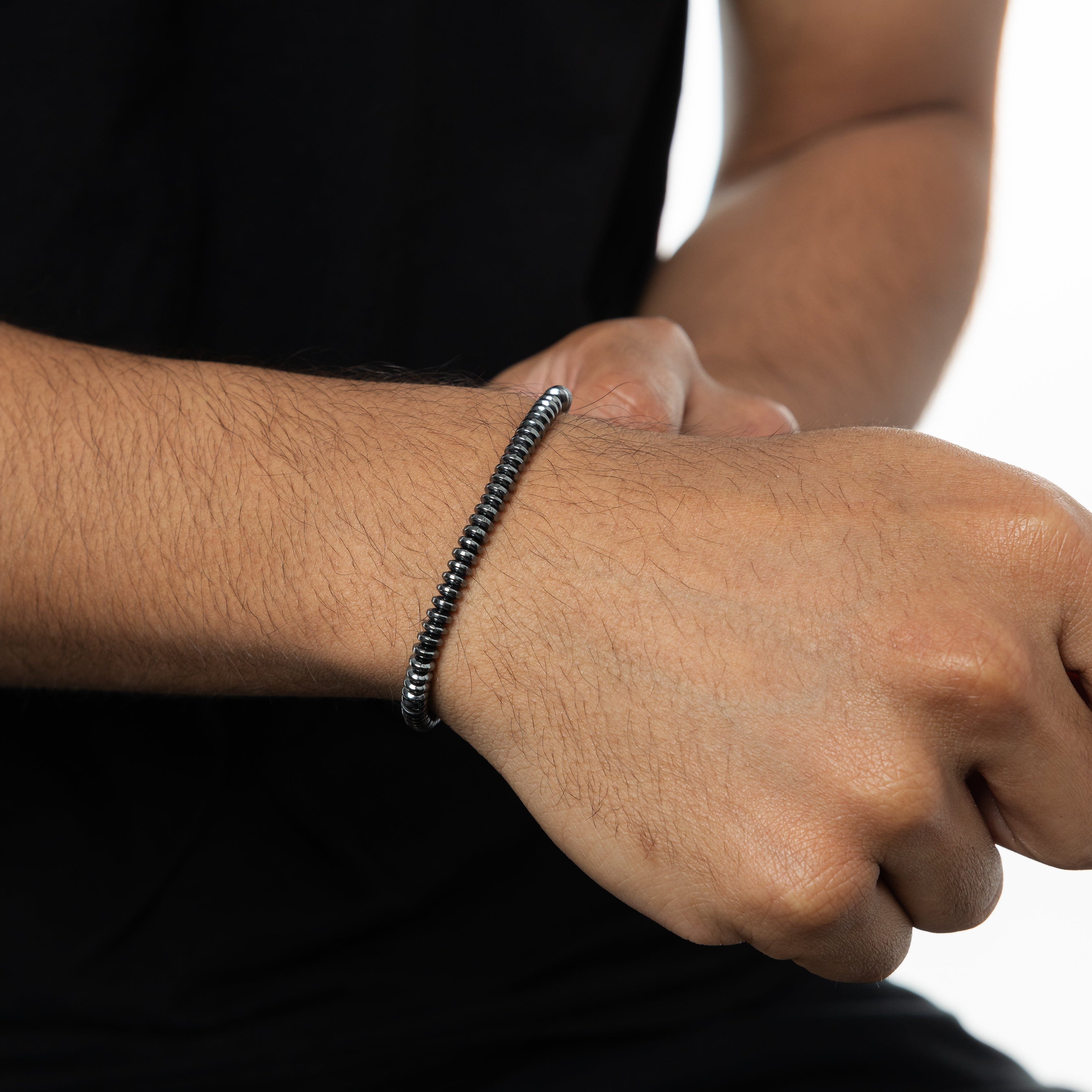 Man wearing the Classic Elegance Bead Bracelet, highlighting its understated elegance.