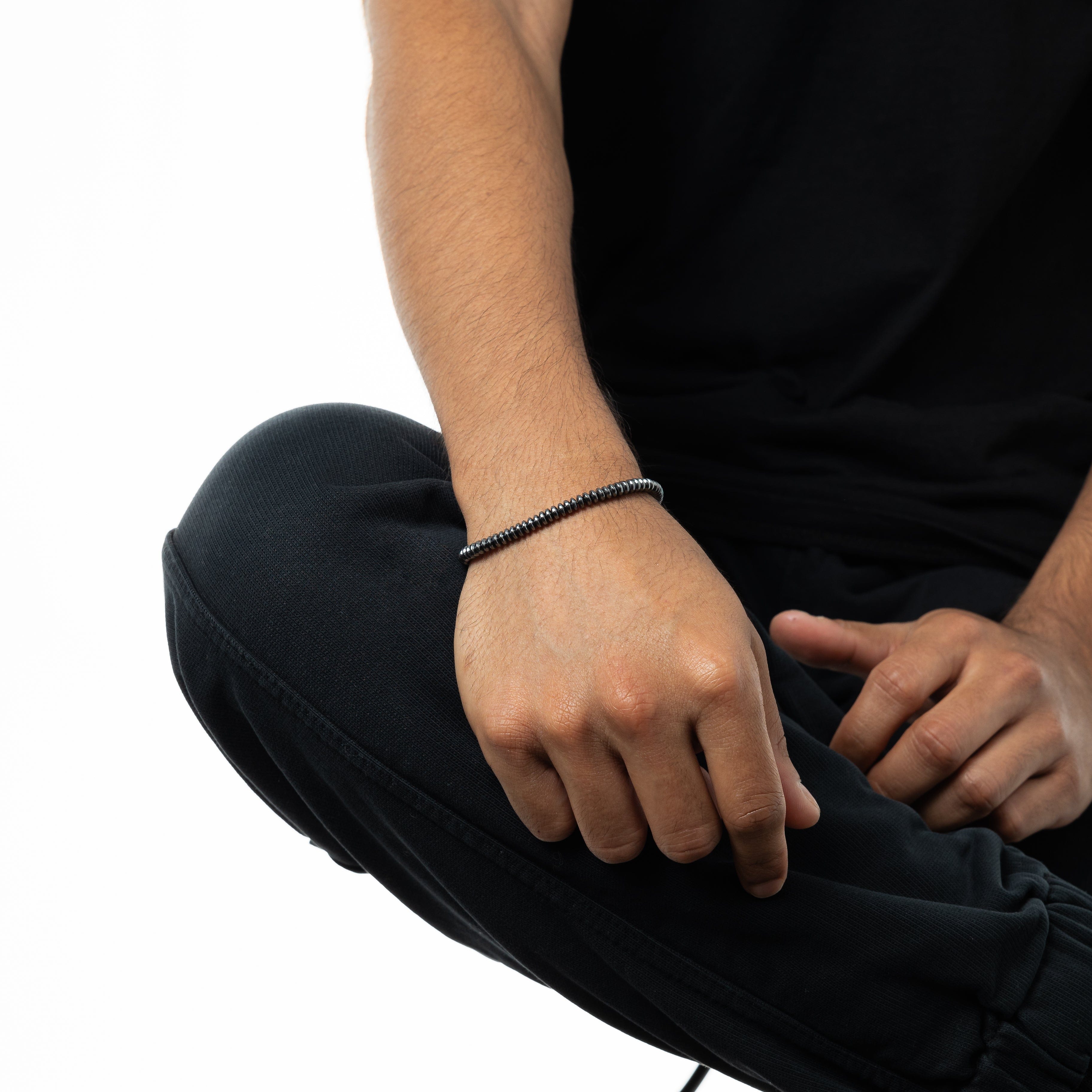 Man wearing the Classic Elegance Bead Bracelet, highlighting its understated elegance.
