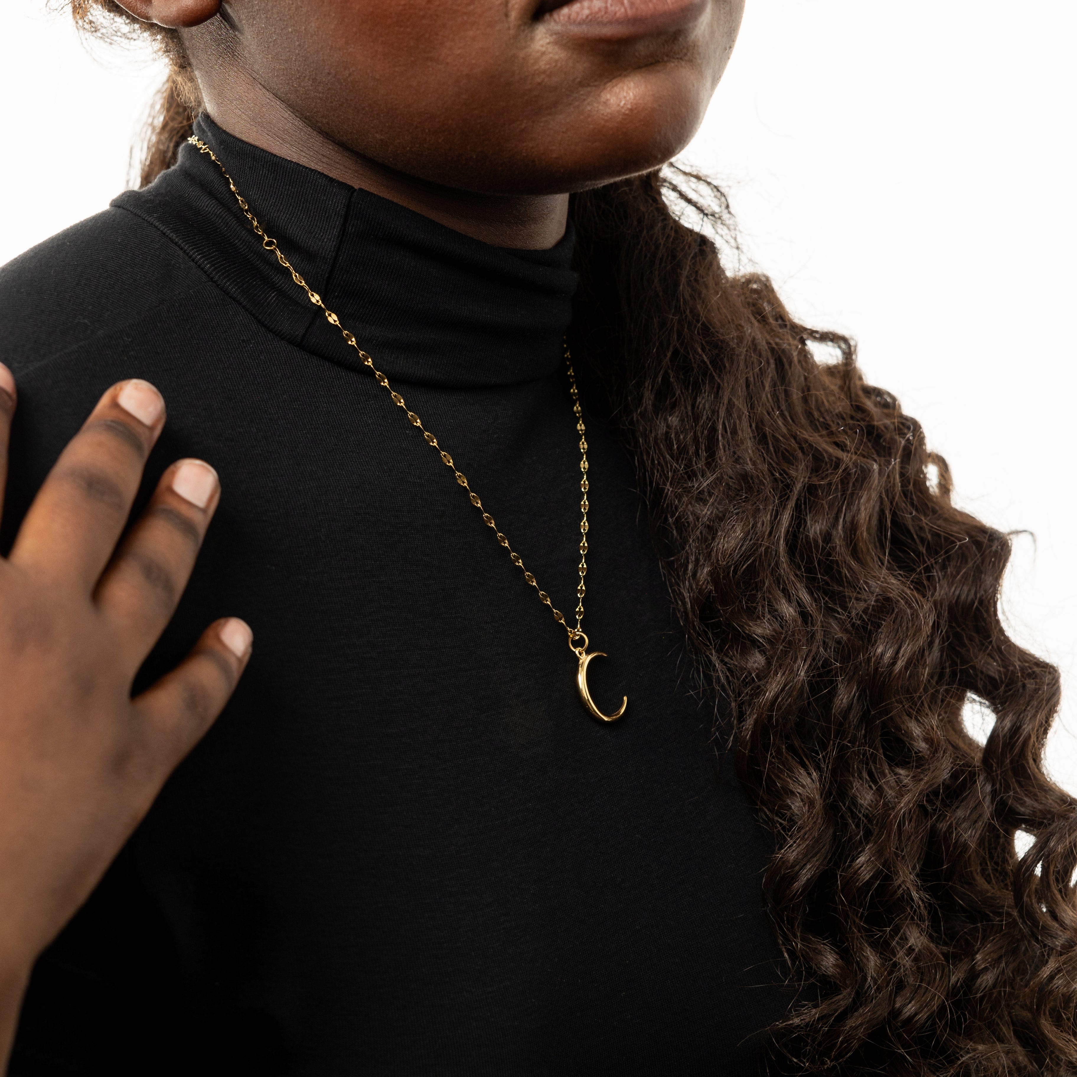 Necklace laid out on a velvet pouch, emphasizing the premium quality and hypoallergenic features.