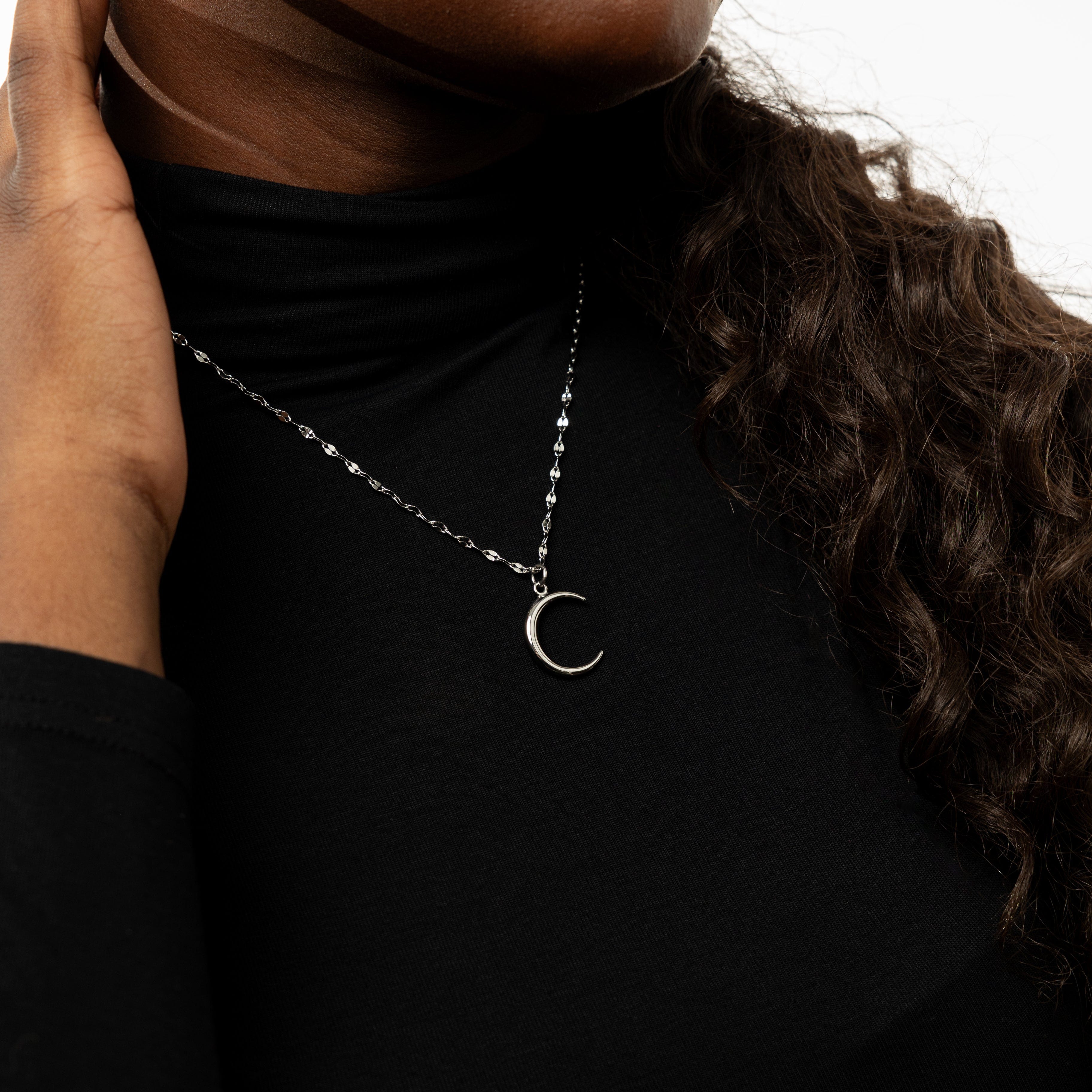 Necklace laid out on a velvet pouch, emphasizing the premium quality and hypoallergenic features.