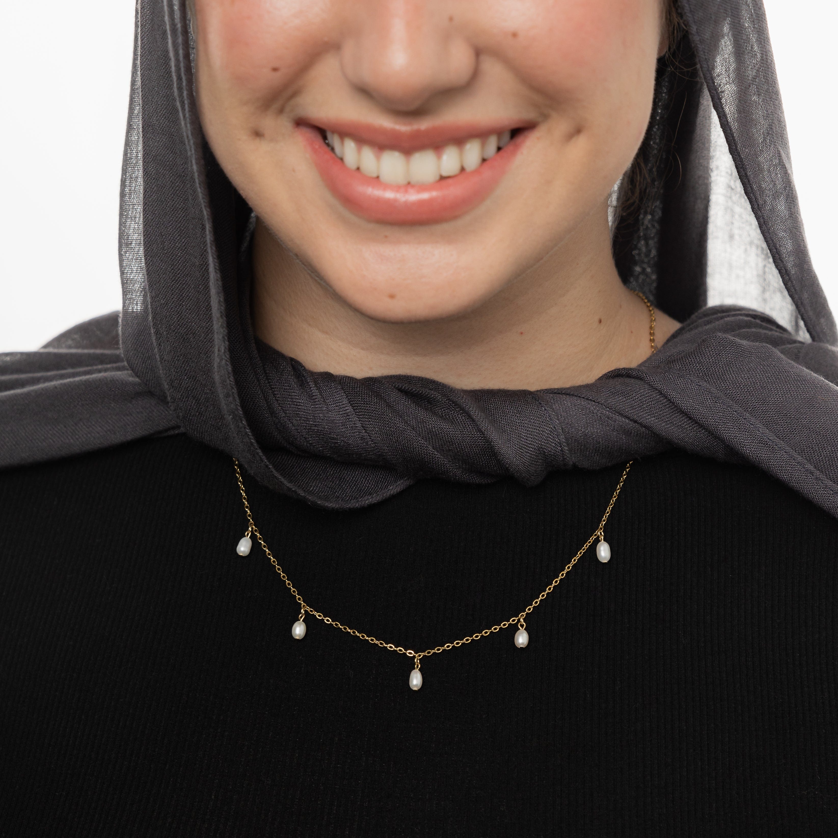 Luminous Raining Pearls Necklace displayed on a white background, showcasing the elegant pearl droplets.