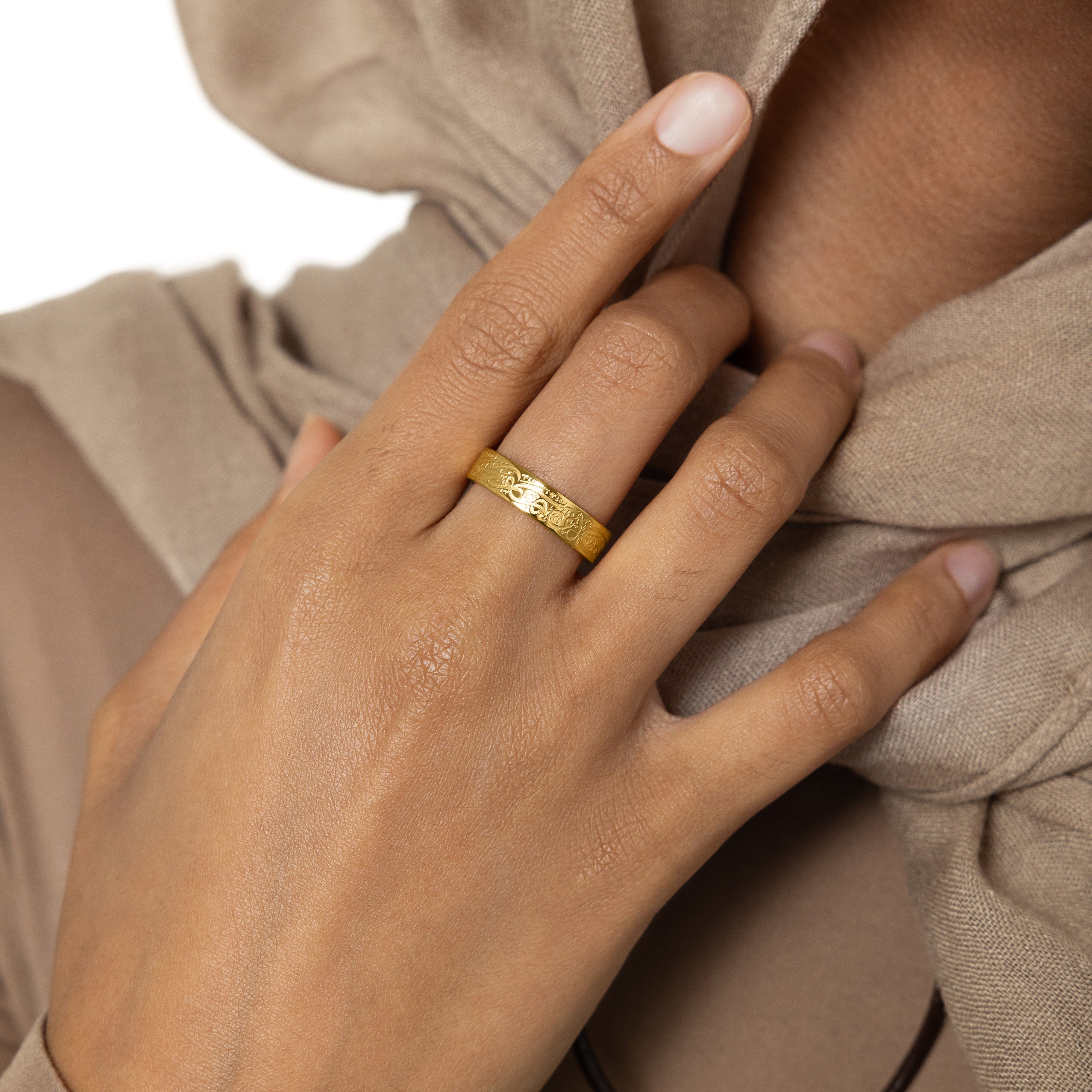 Rumi ring displayed on a hand, highlighting its elegant design and message.