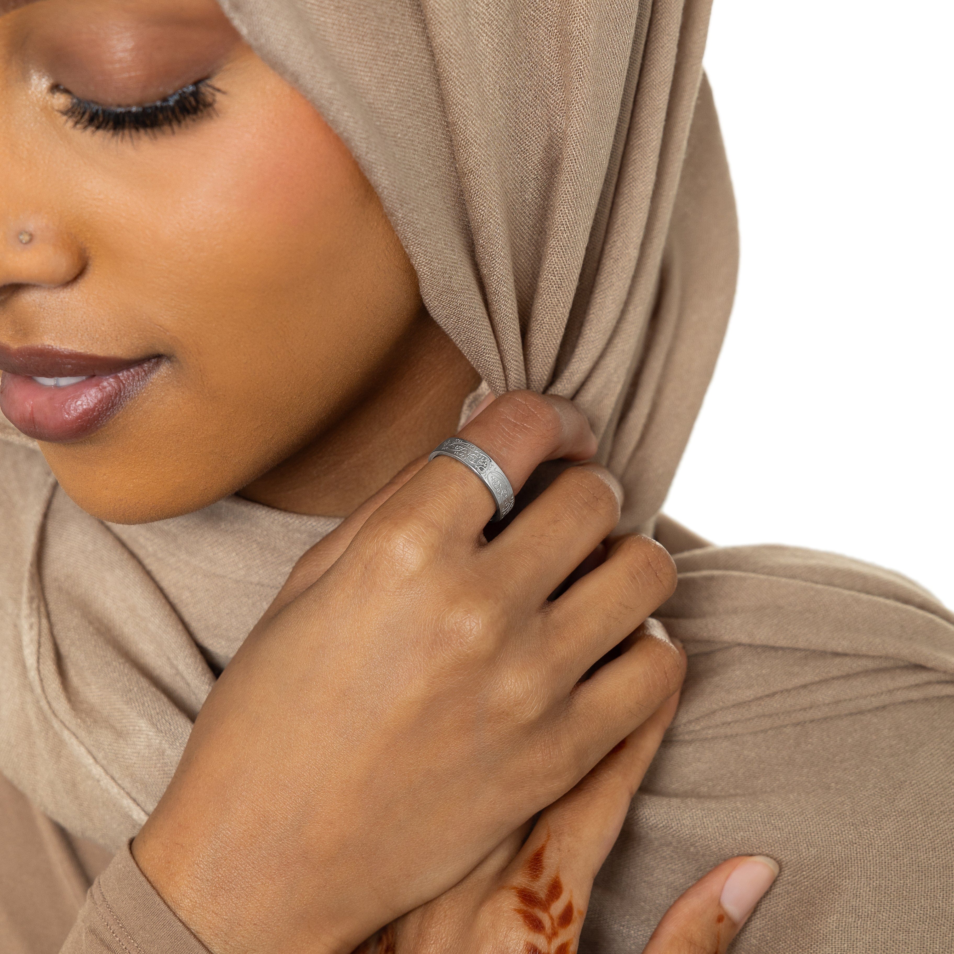 Rumi ring displayed on a hand, highlighting its elegant design and message.