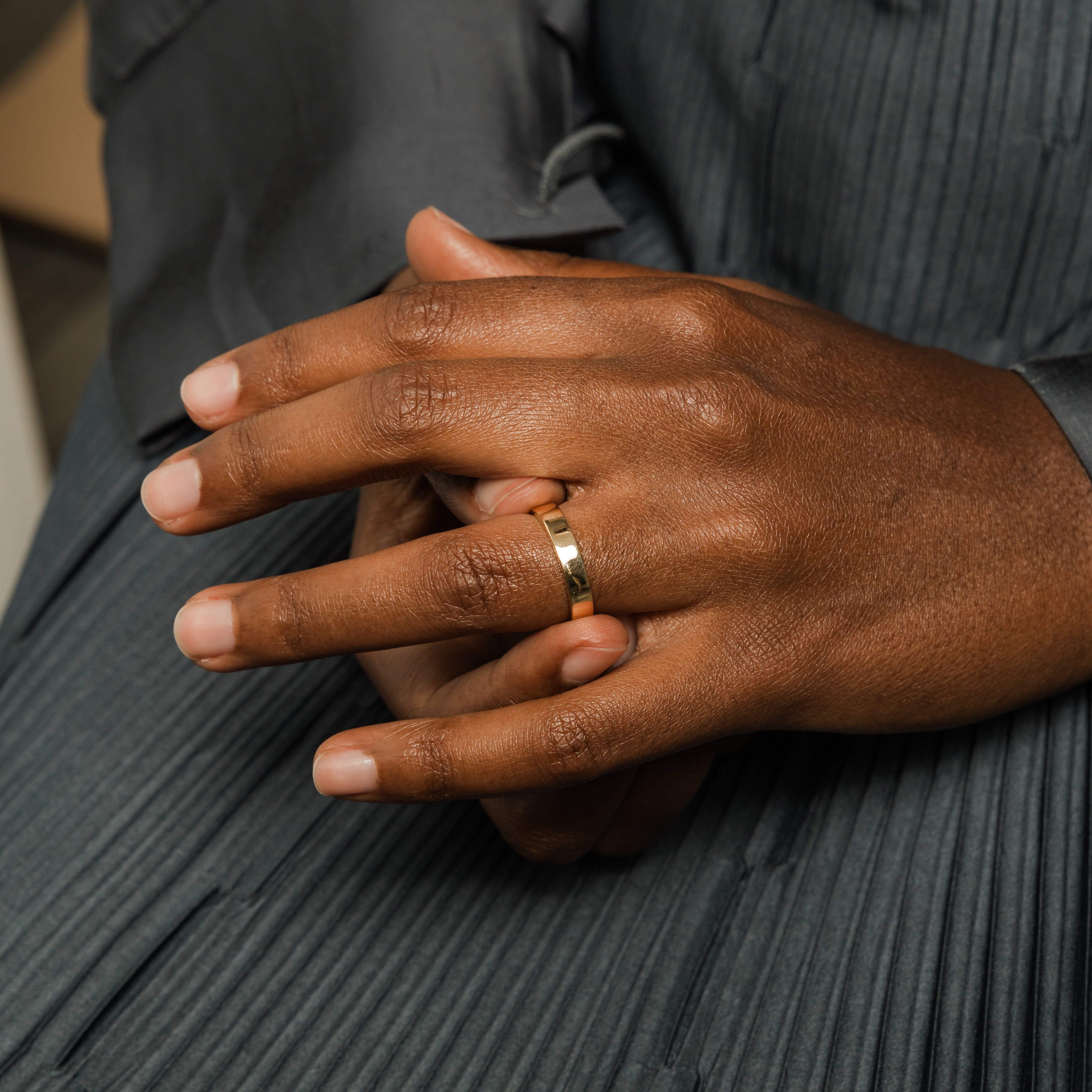 Stacked view of the Timeless 18K Solid Gold Wedding Band with other best stackable rings for women.