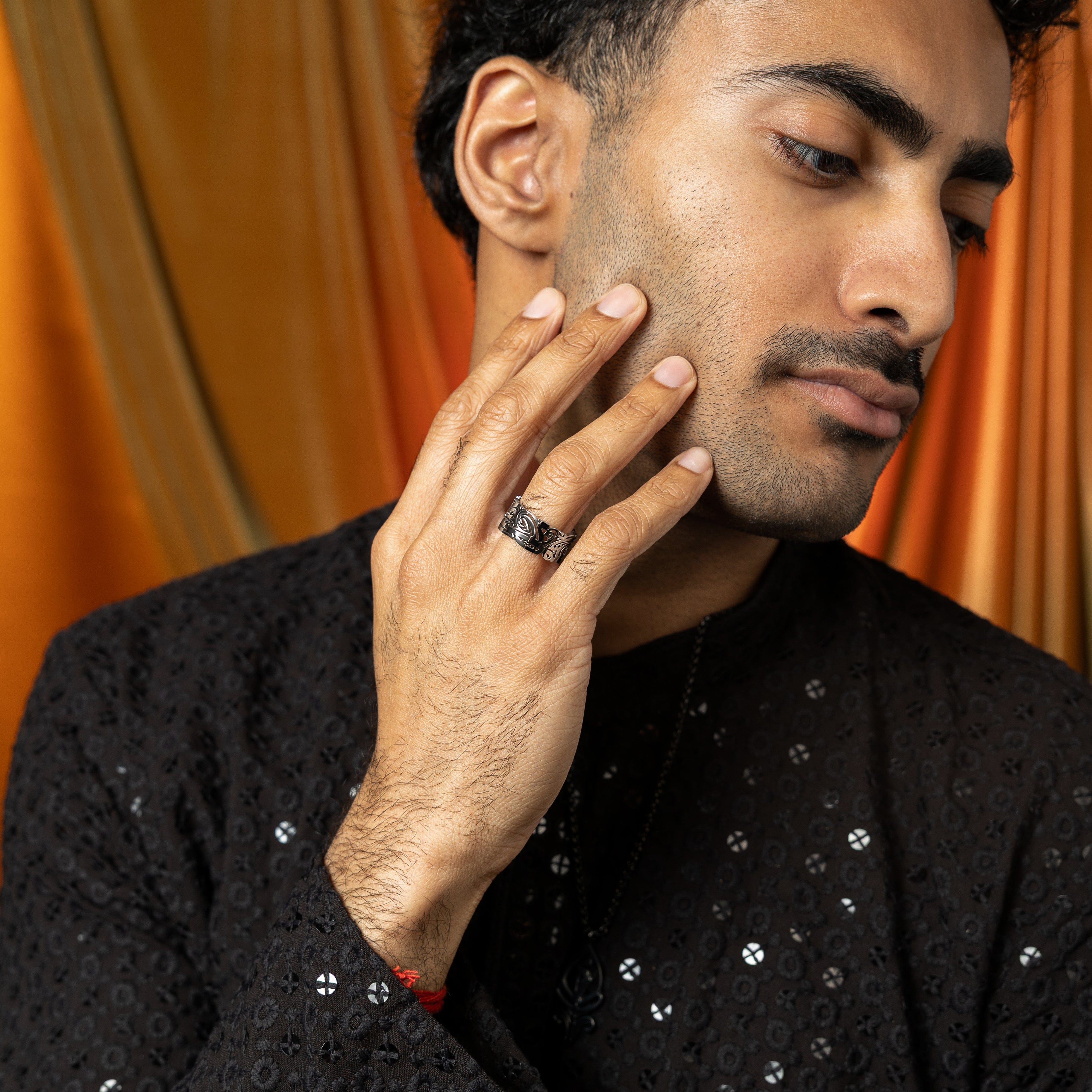Close-up of the EASE Arabic calligraphy stainless steel ring for men, showcasing its intricate design.