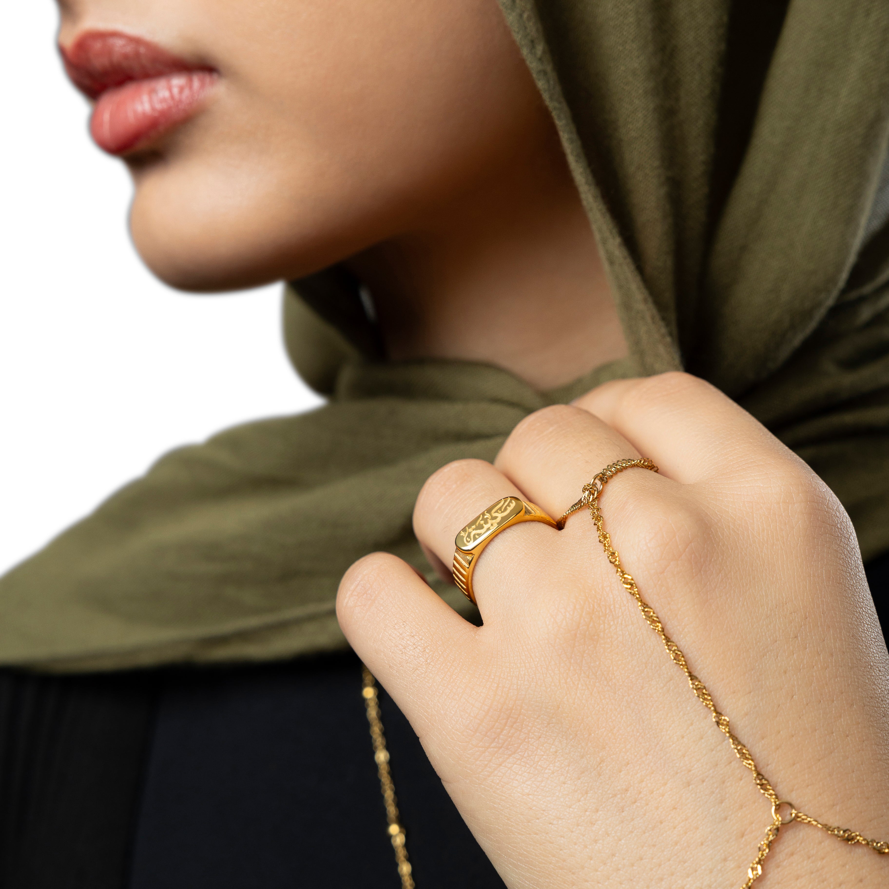 Close-up of the gold plated ring showing Sakinah Arabic engraving and oval top detail