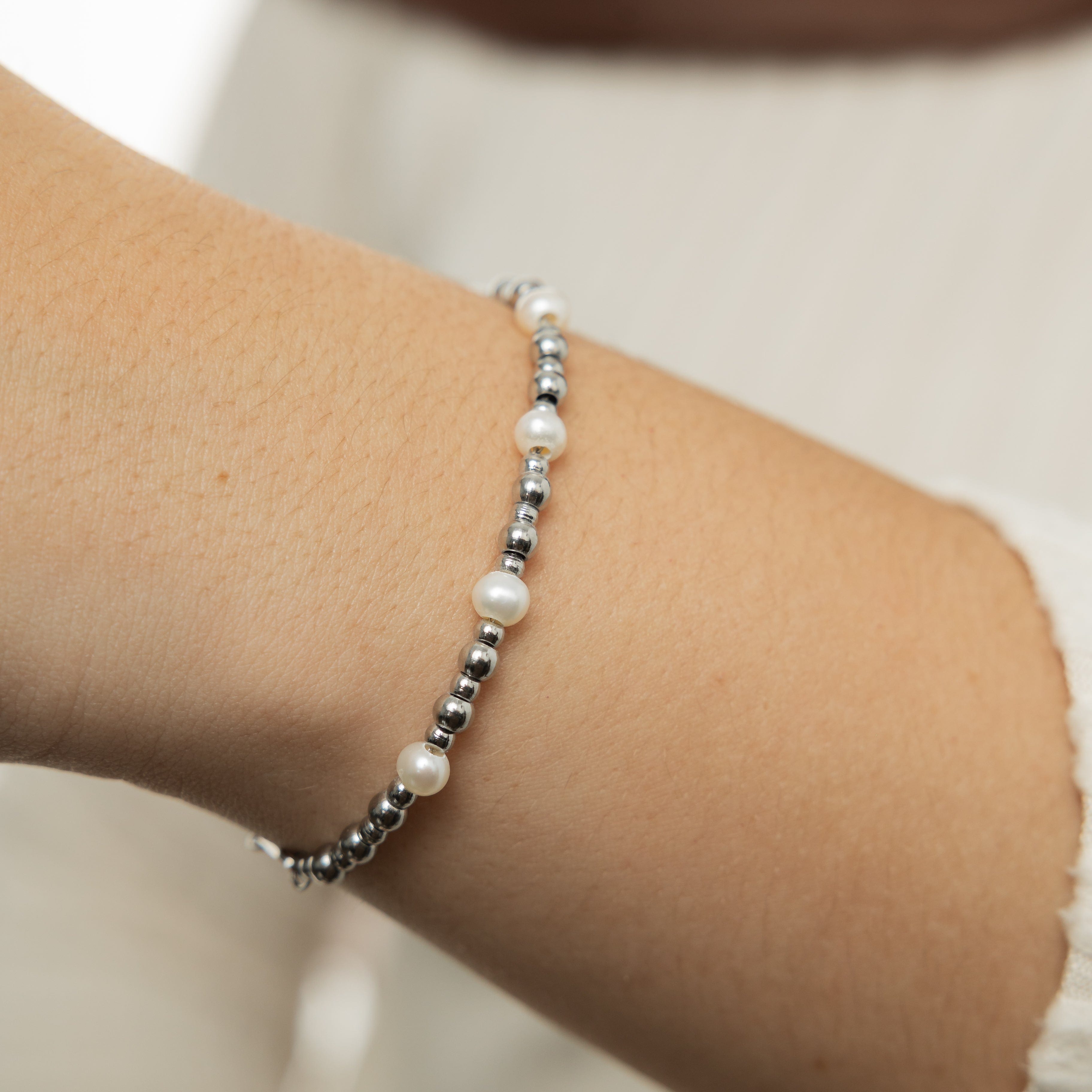 Close-up of the waterproof pearl bracelet highlighting its intricate design and hypoallergenic materials suitable for sensitive skin.