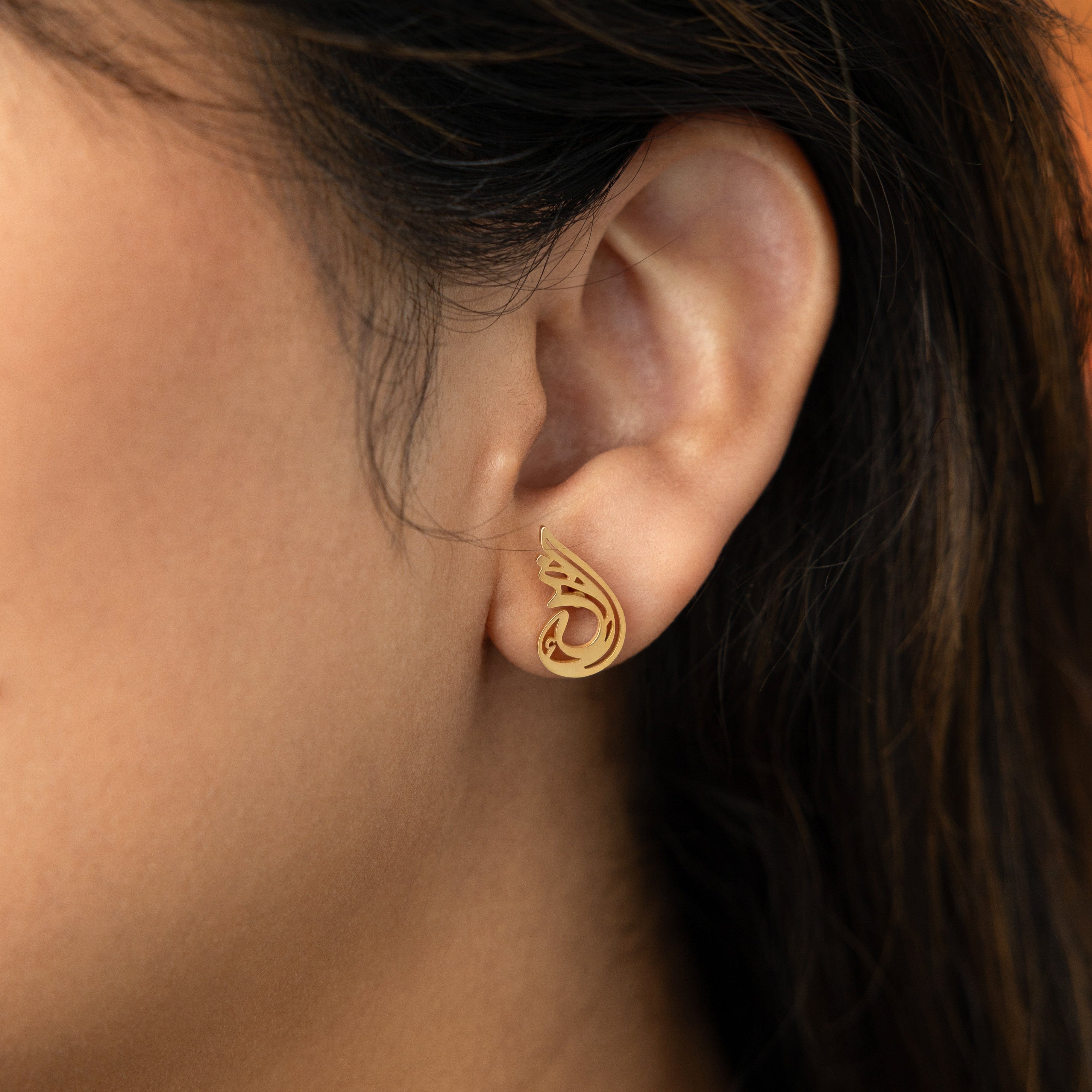 Close-up of Serenity earrings, highlighting the 18 Karat gold plating on pure stainless steel.