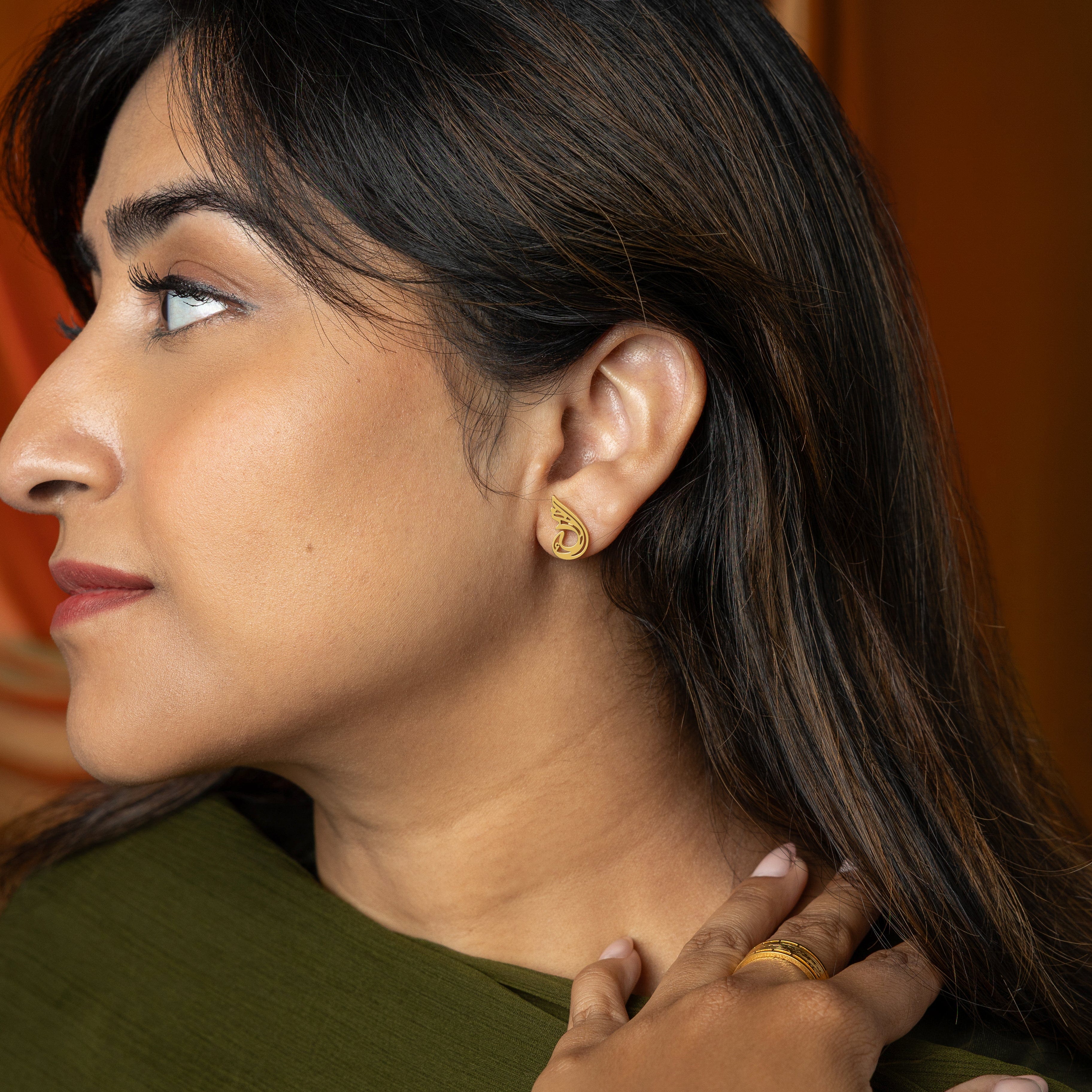 Serenity earrings displayed in a Nominal velvet pouch, emphasizing their elegance and quality.