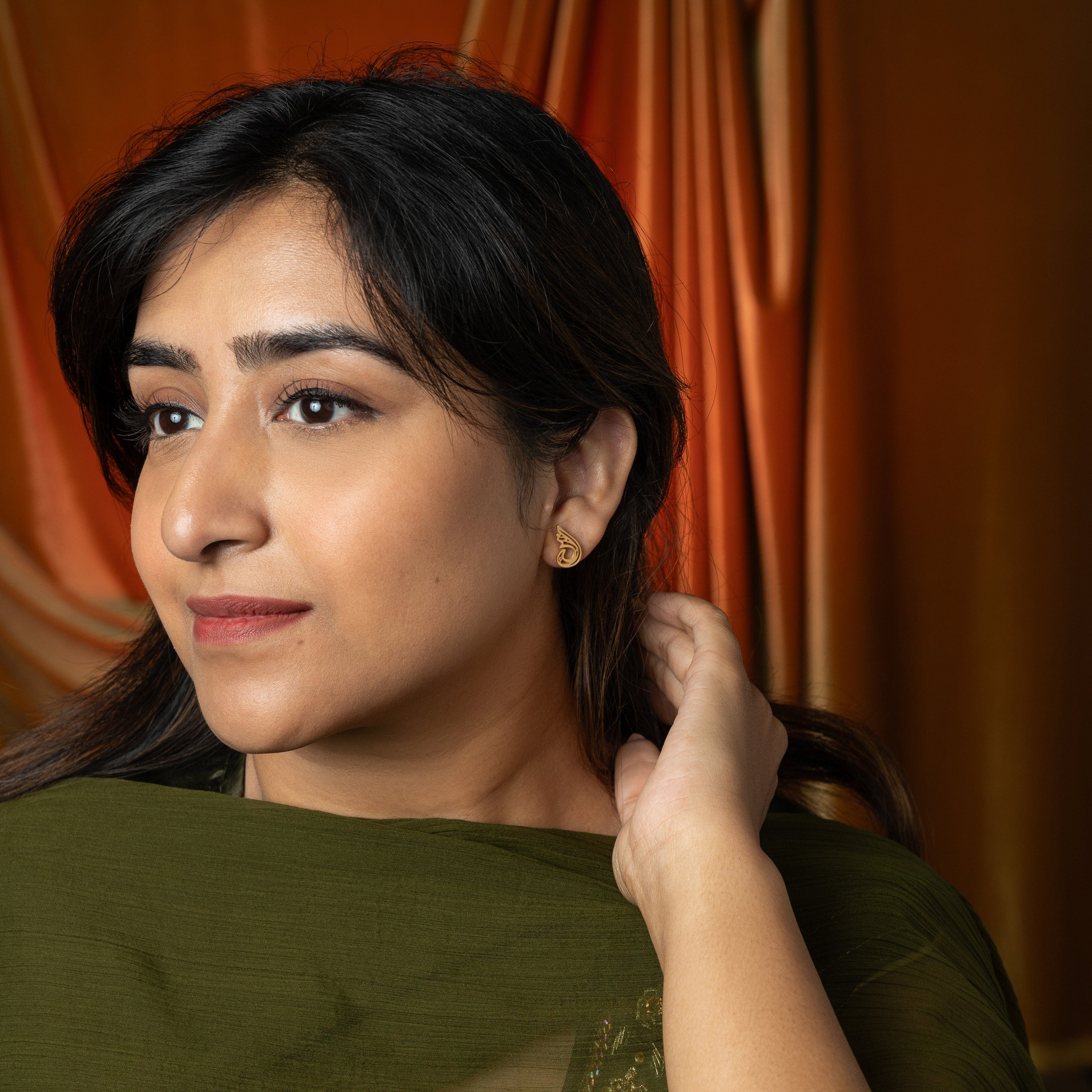 Serenity gold plated earrings showcasing intricate Arabic calligraphy, perfect for sensitive ears.
