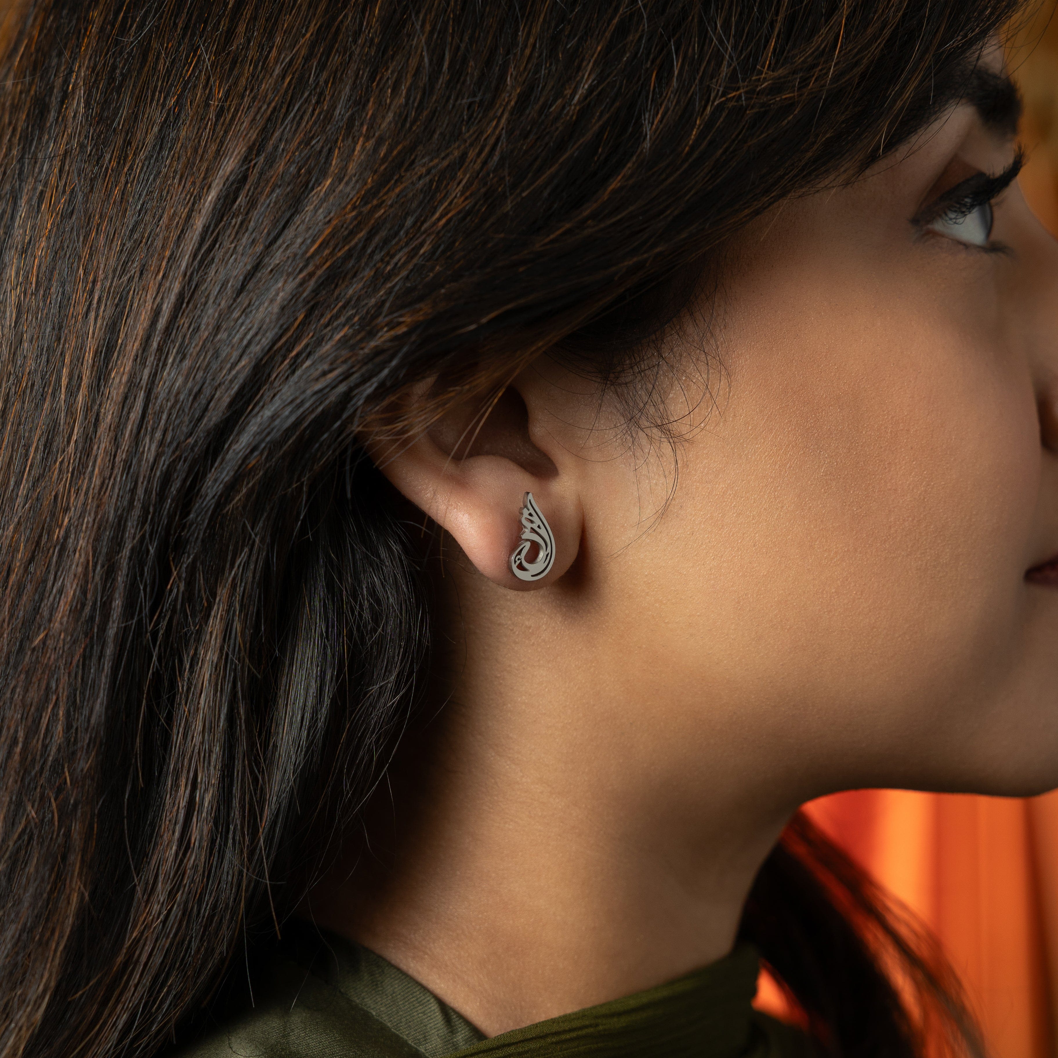 Serenity gold plated earrings showcasing intricate Arabic calligraphy, perfect for sensitive ears.