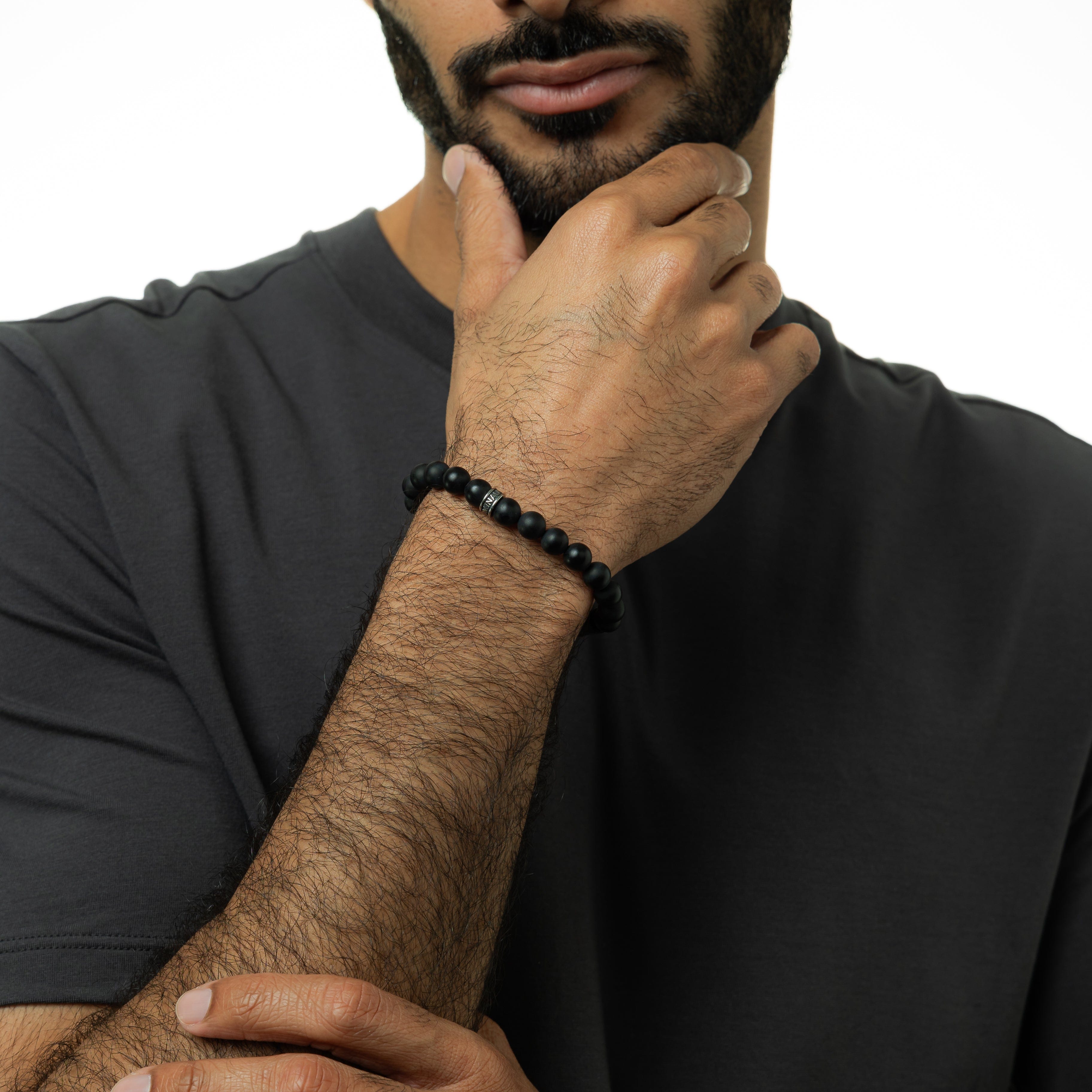 Close-up of the Cosmic Matte Black Stone Bracelet showcasing its smooth texture and matte finish.