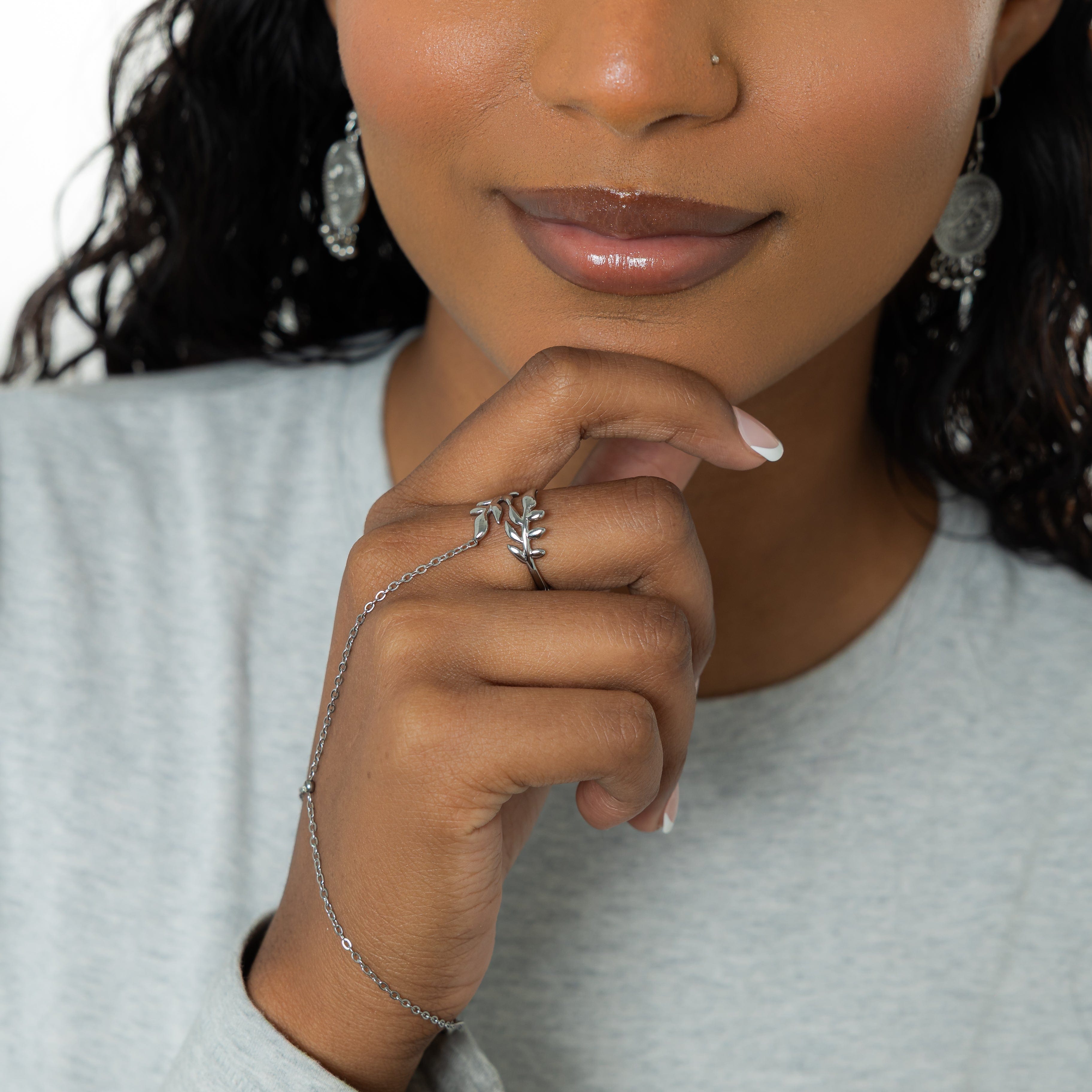 Close-up of the Elegant Olive Leaf Hand Chain displaying its intricate design and stone.