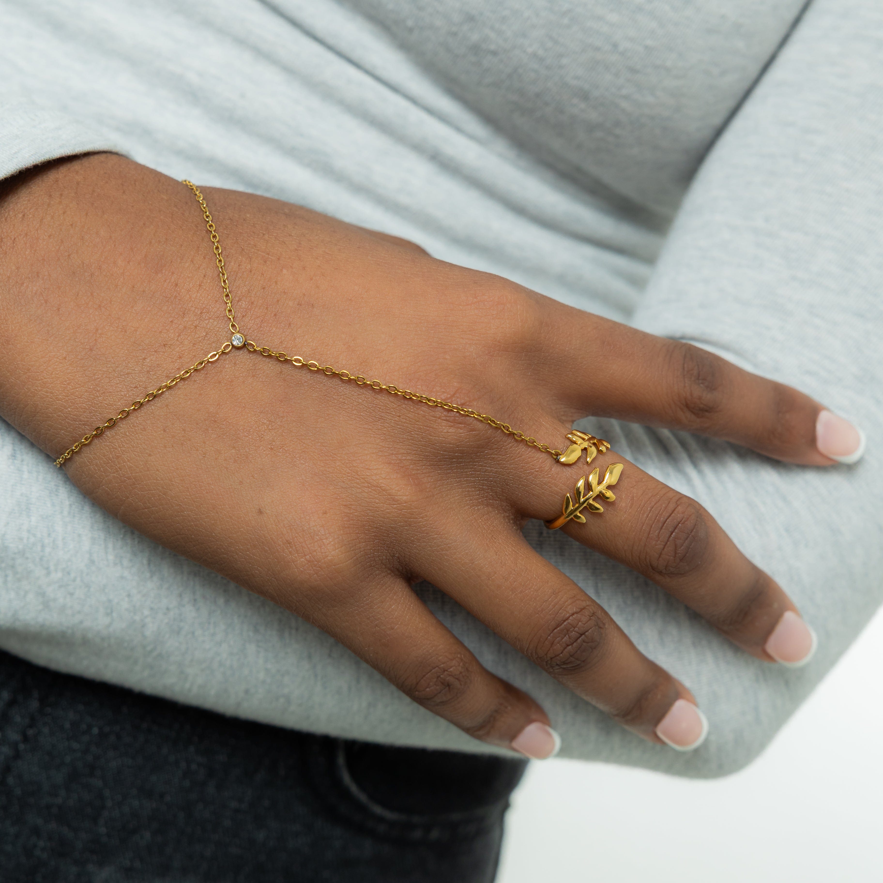 Model wearing the Elegant Olive Leaf Hand Chain, emphasizing its unique everyday wear jewelry style.