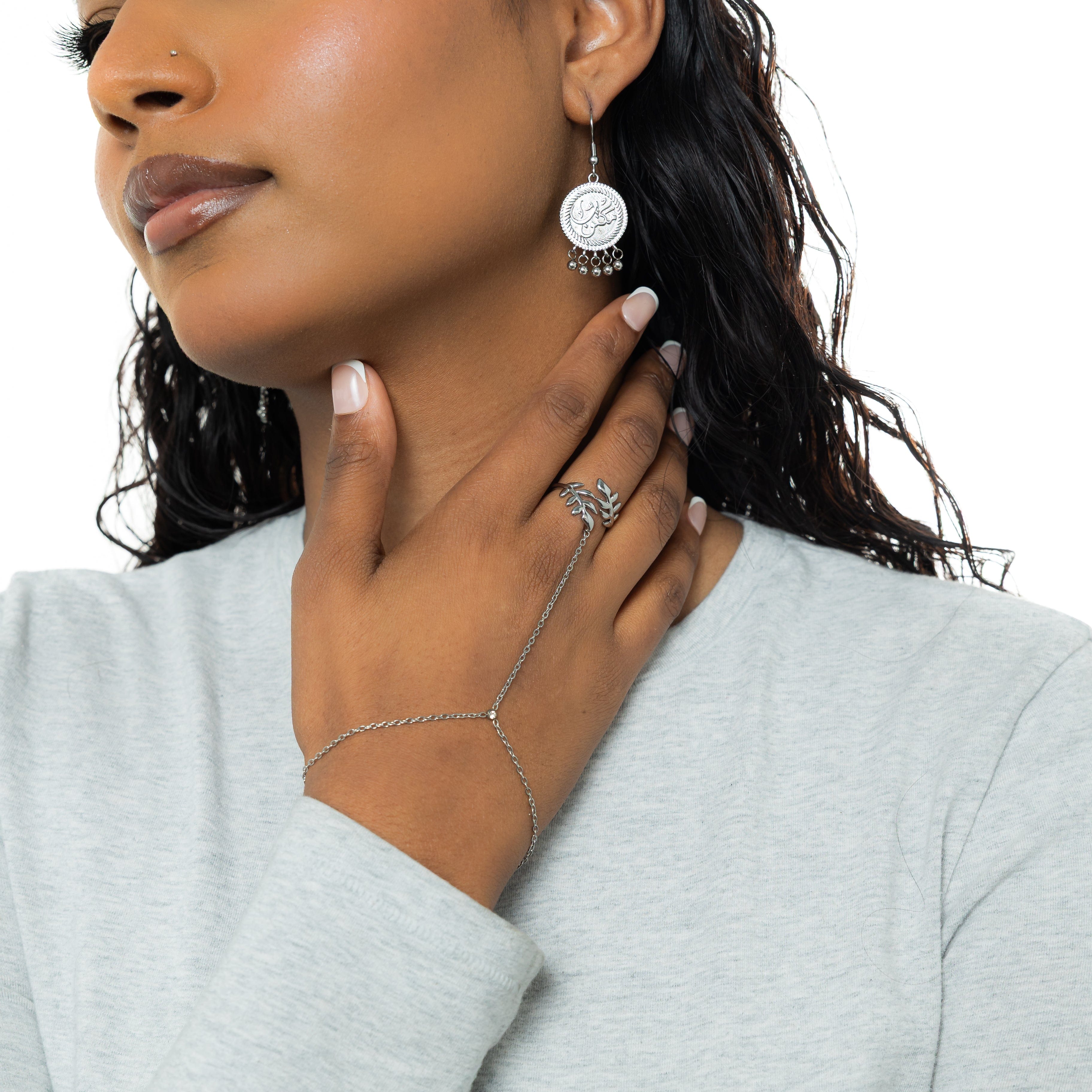 Model wearing the Elegant Olive Leaf Hand Chain, emphasizing its unique everyday wear jewelry style.