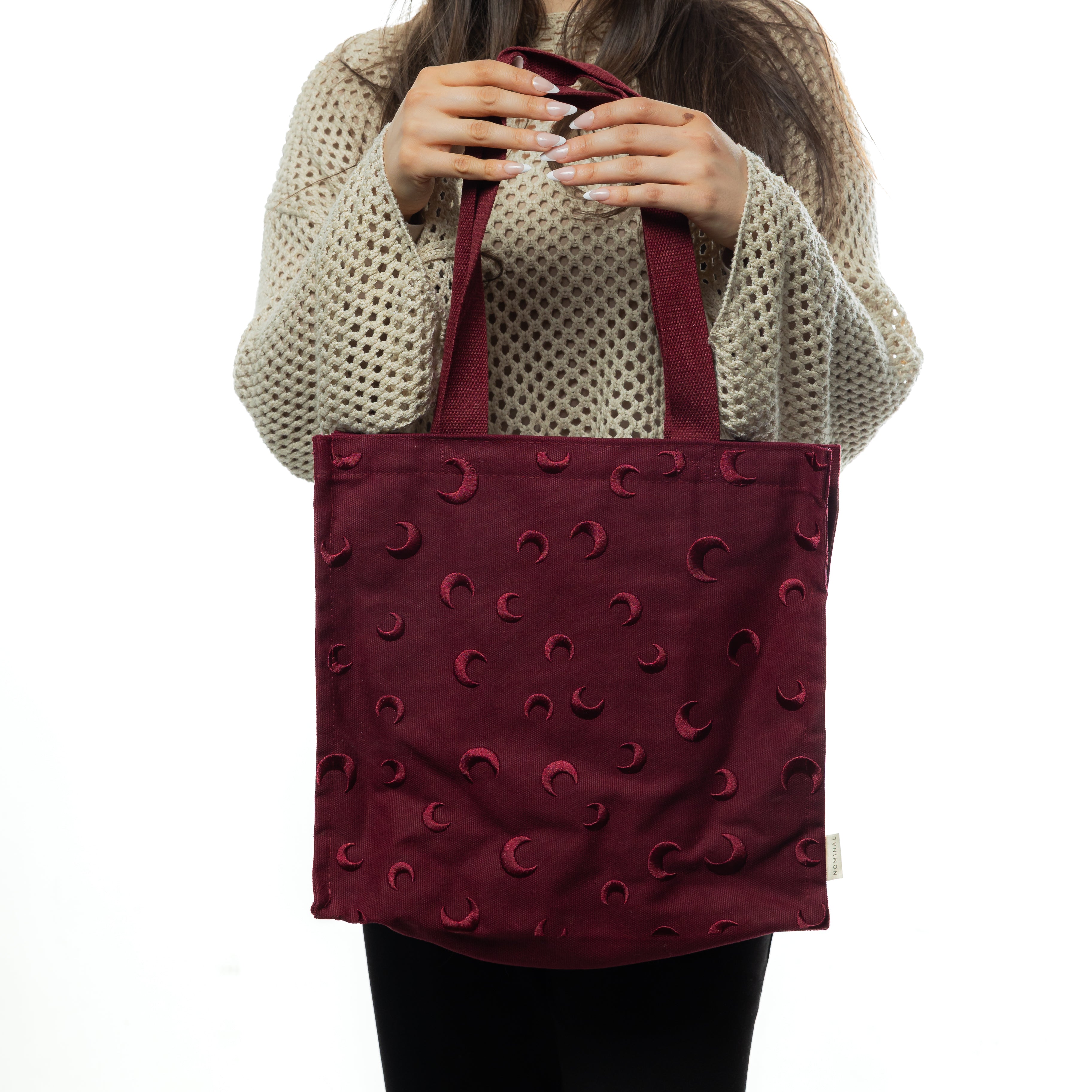 Celestial Charm fashion tote showcasing embroidered design and deep red color from the front angle.