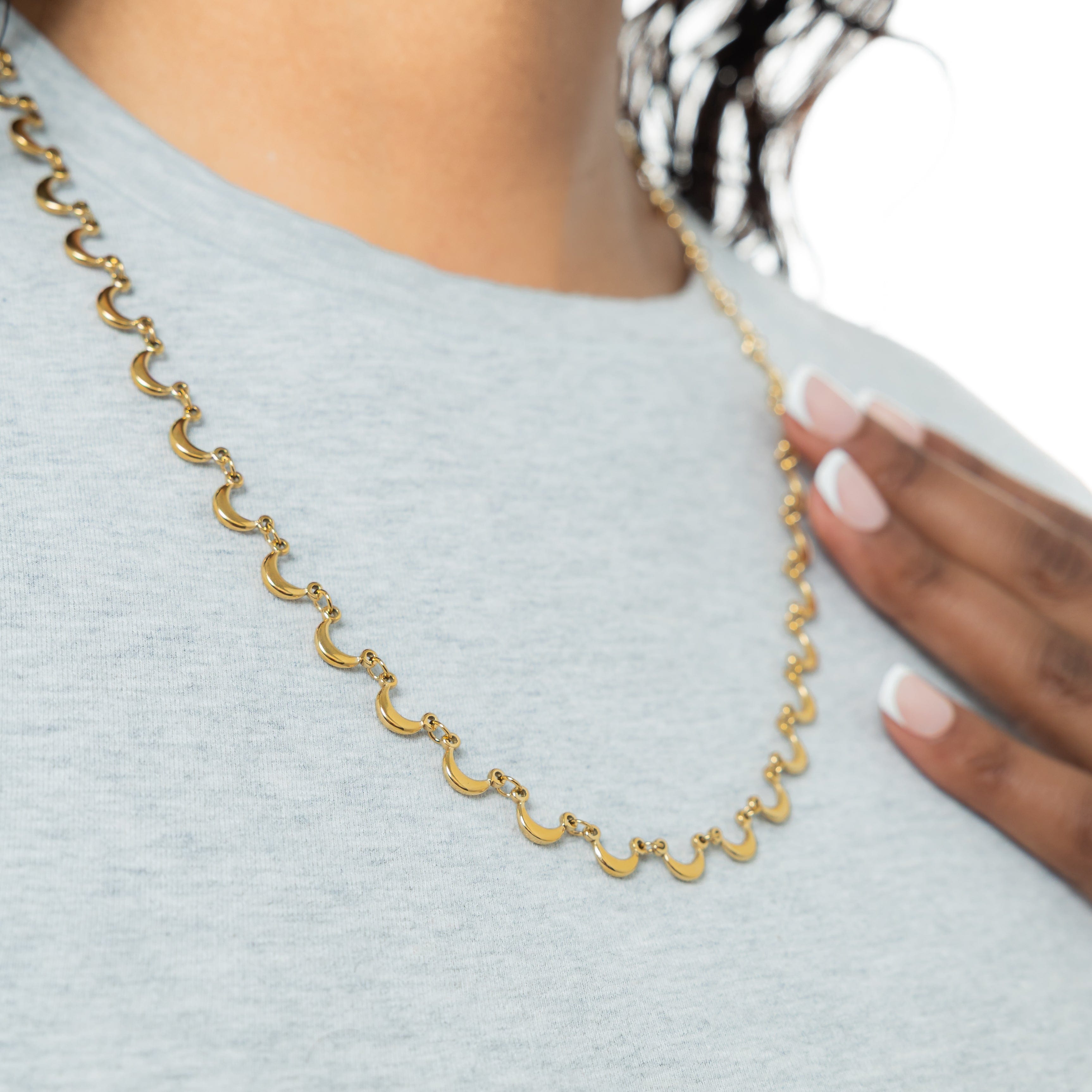 Close-up of the golden moons on the Celestial Elegance Necklace.