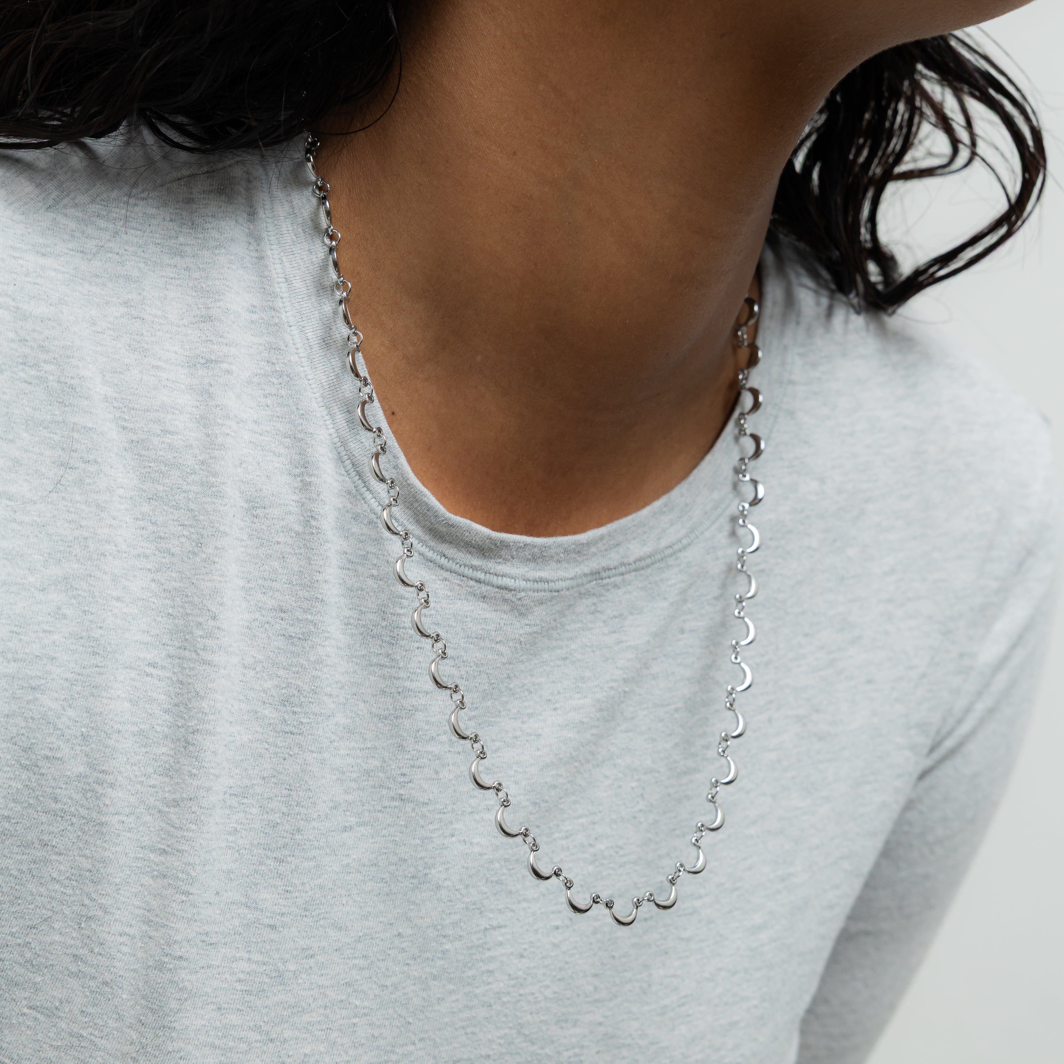 Close-up of the golden moons on the Celestial Elegance Necklace.