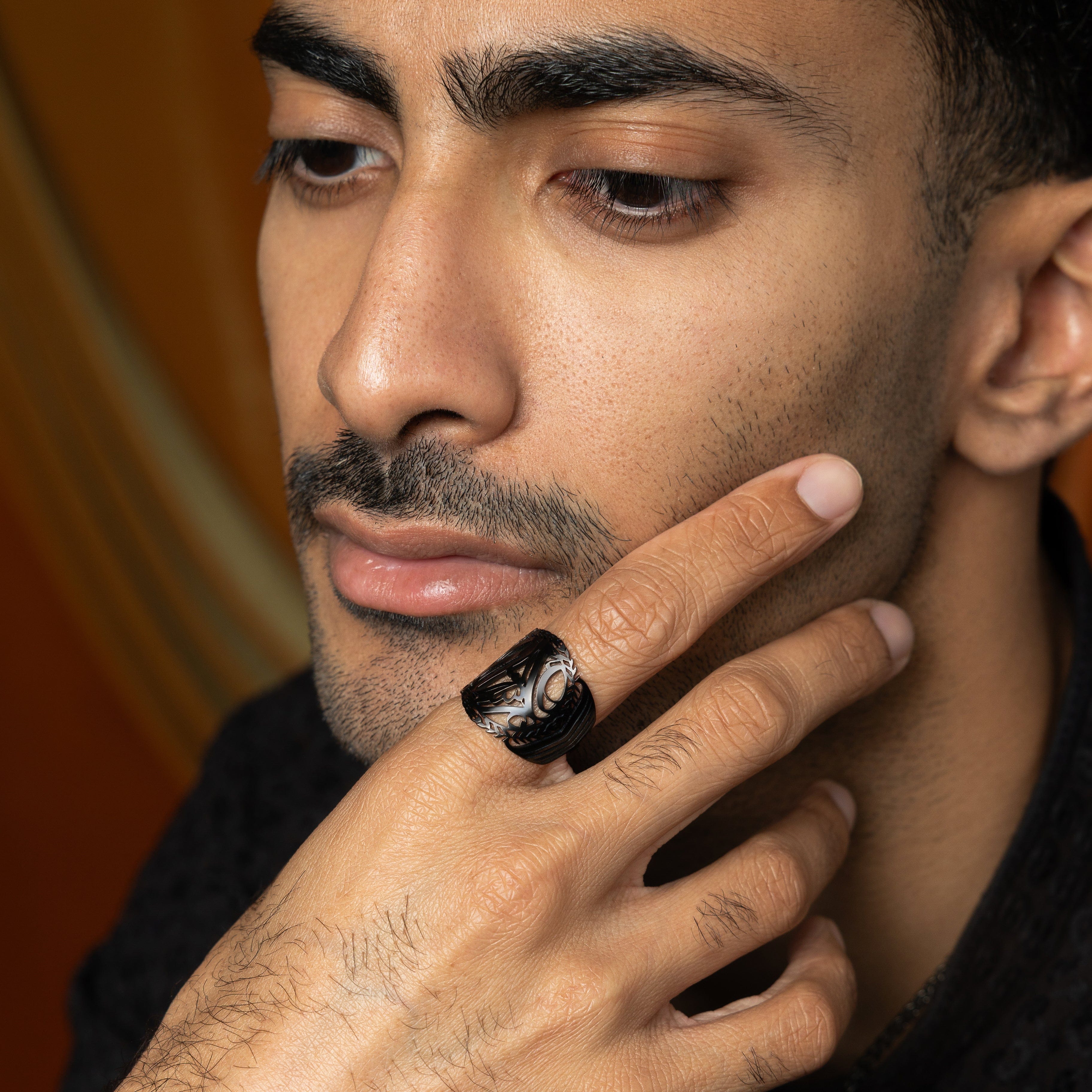 Sufficient Strength Stainless Steel Mens Ring in natural light, showcasing the Arabic calligraphy