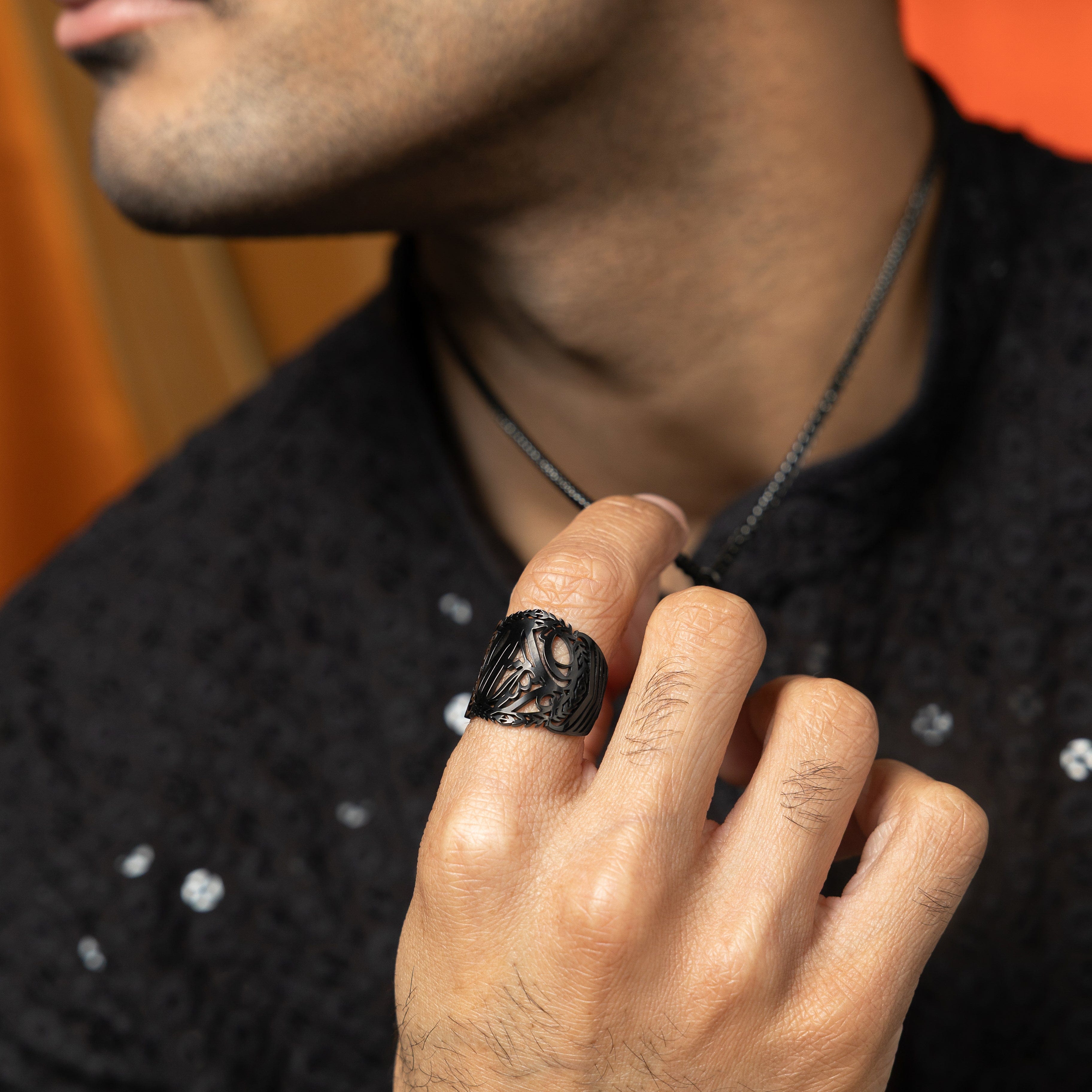 Sufficient Strength Stainless Steel Mens Ring in natural light, showcasing the Arabic calligraphy