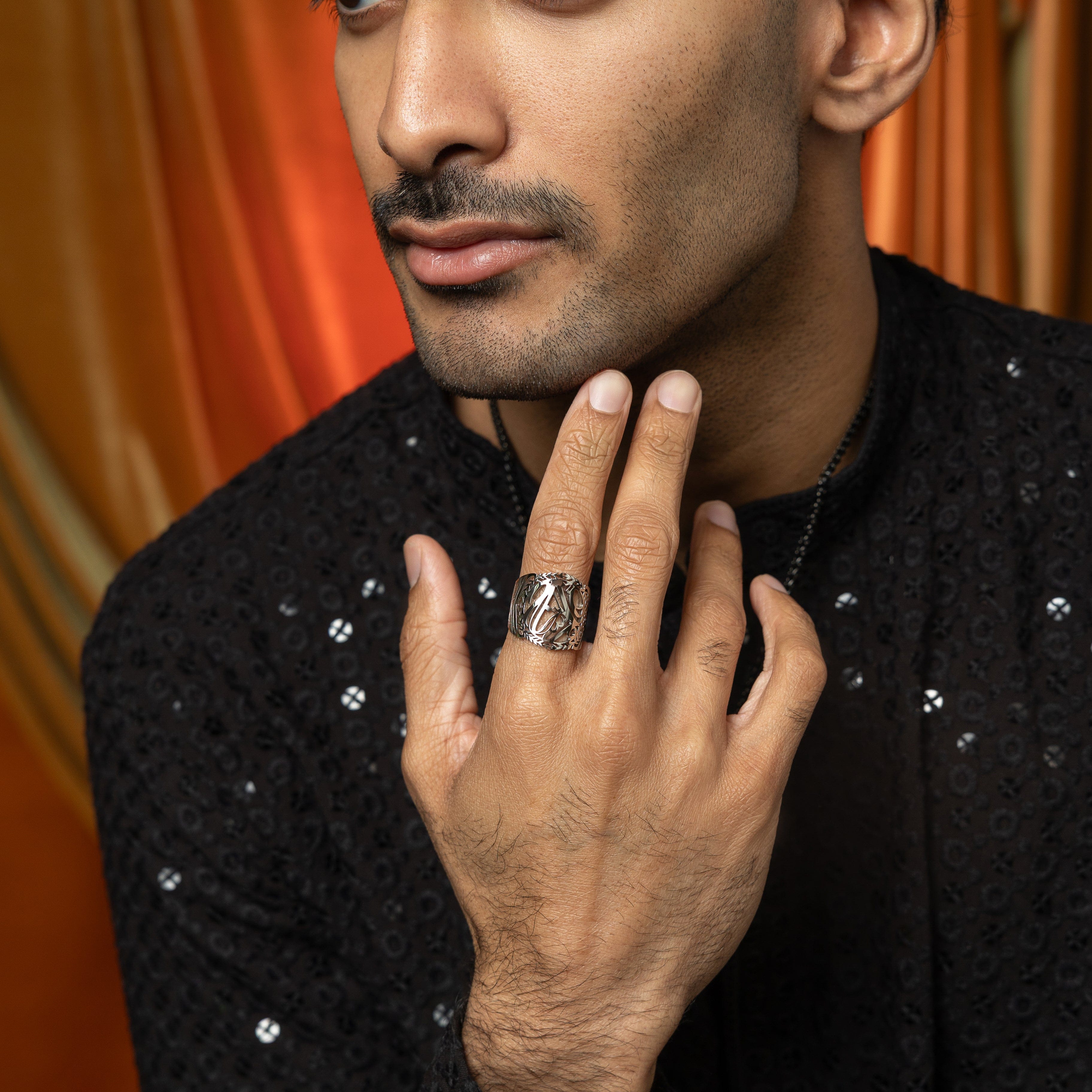 Sufficient Strength Stainless Steel Mens Ring in natural light, showcasing the Arabic calligraphy