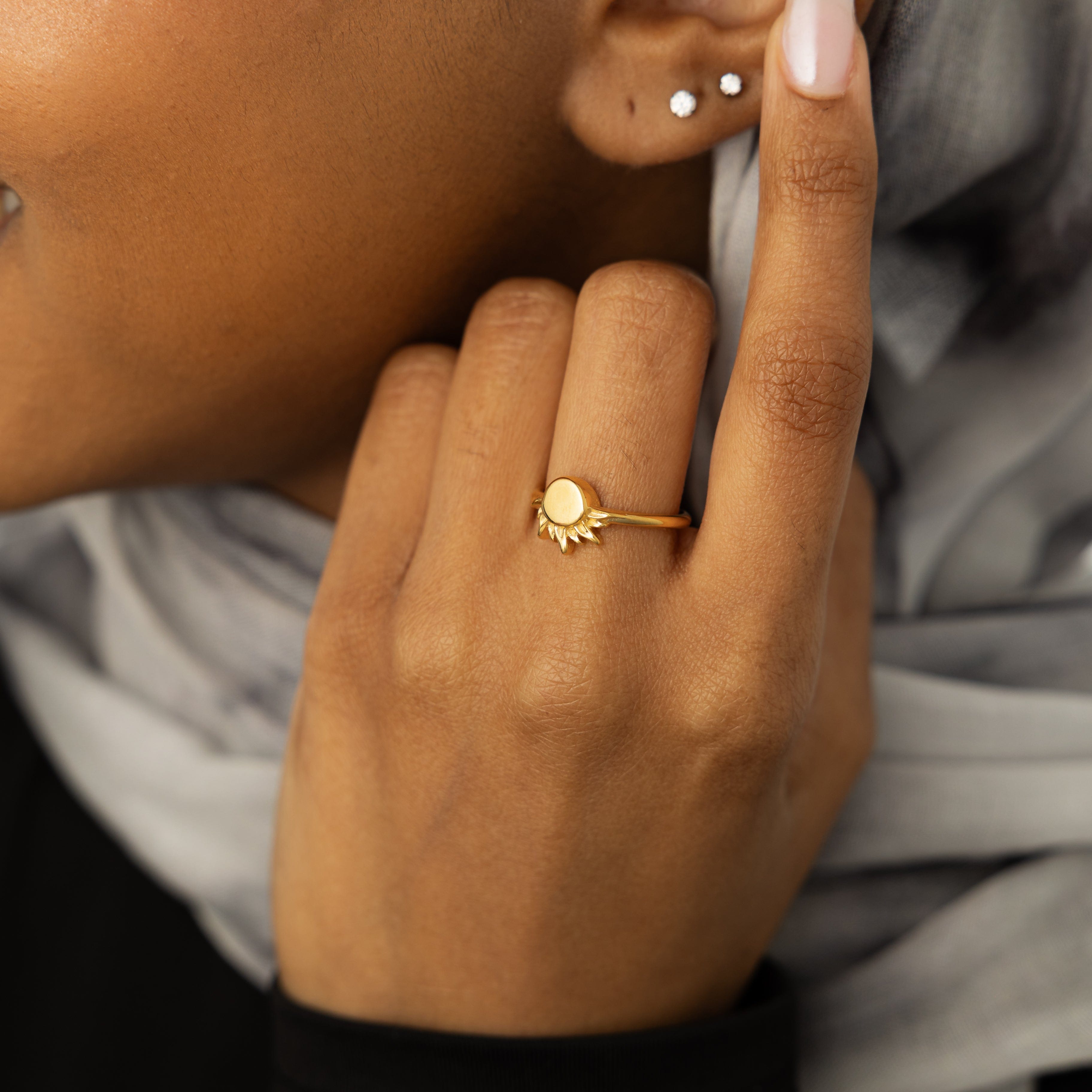 Close-up of the Radiant Sun Ring featuring the swirl sun design, perfect for sensitive skin.
