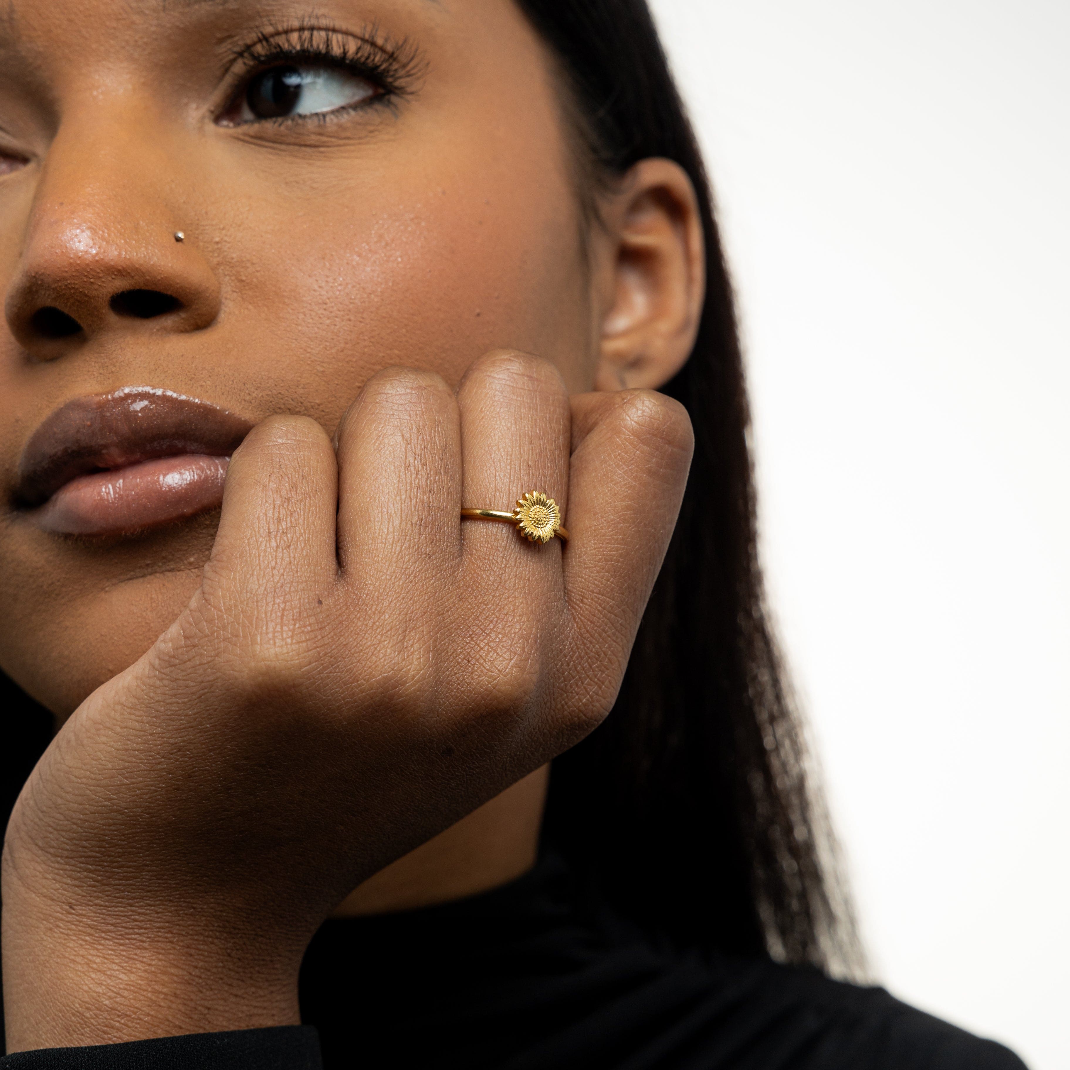 Sunflower ring styled with other fashion jewelry pieces for a trendy look.