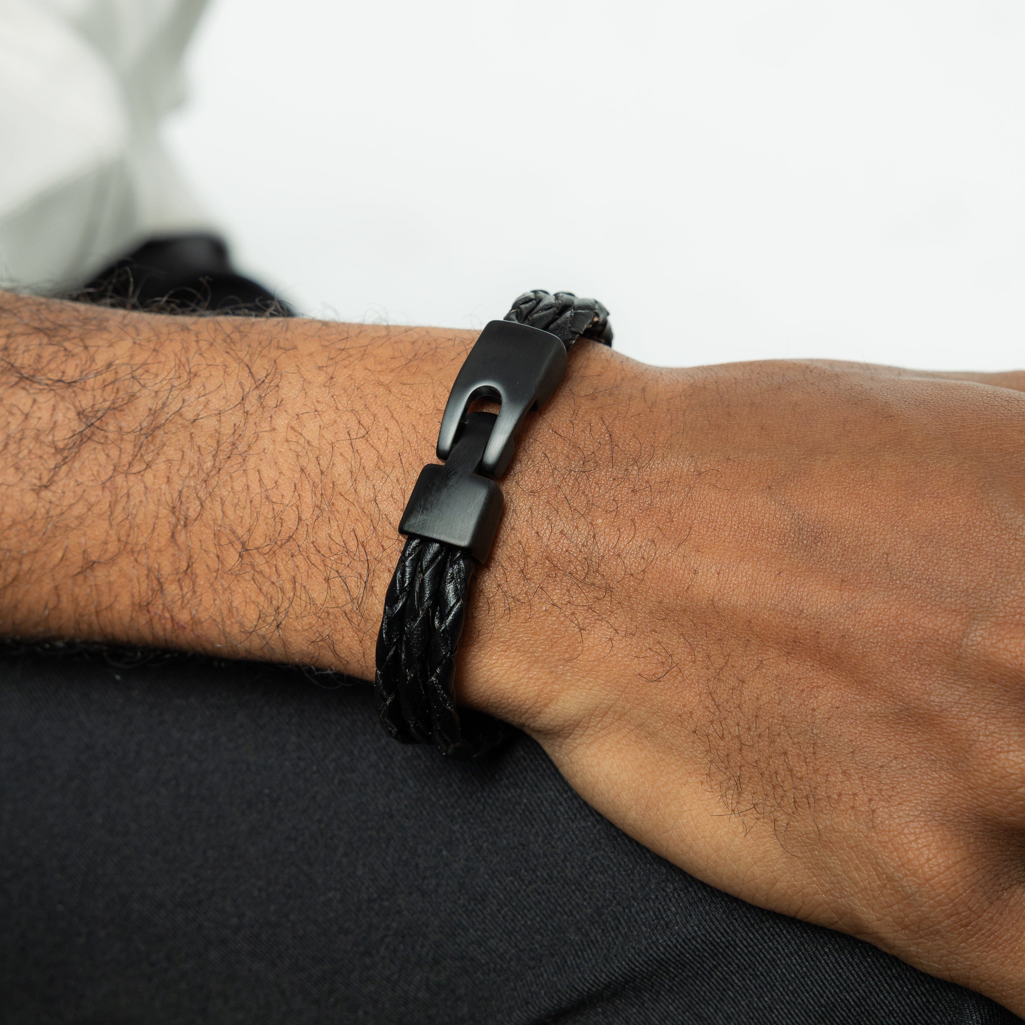 Close-up of the classic triple strand leather bracelet showing its detailed craftsmanship.