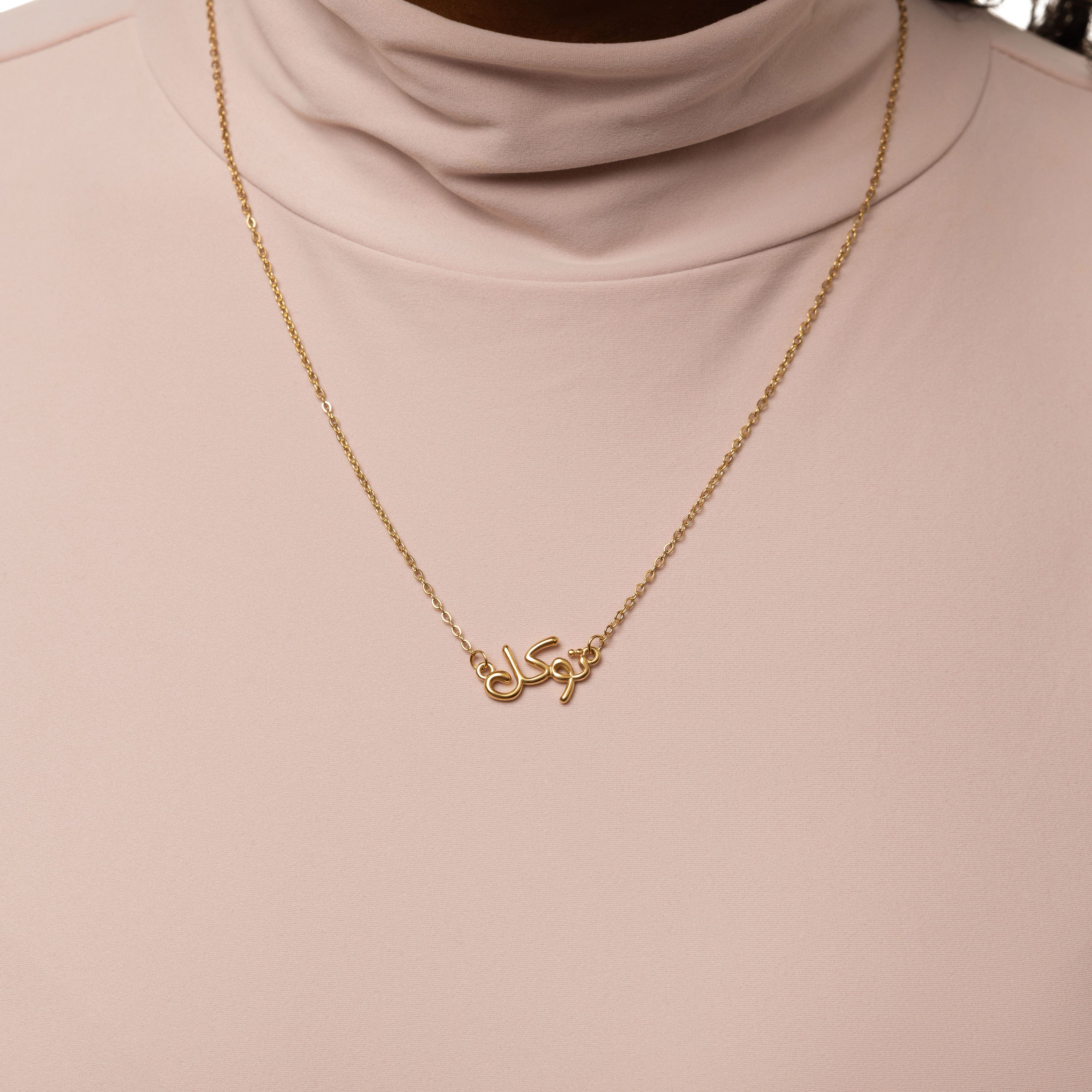 Detailed view of the bubble jewelry showcasing its gold plating and hypoallergenic features.