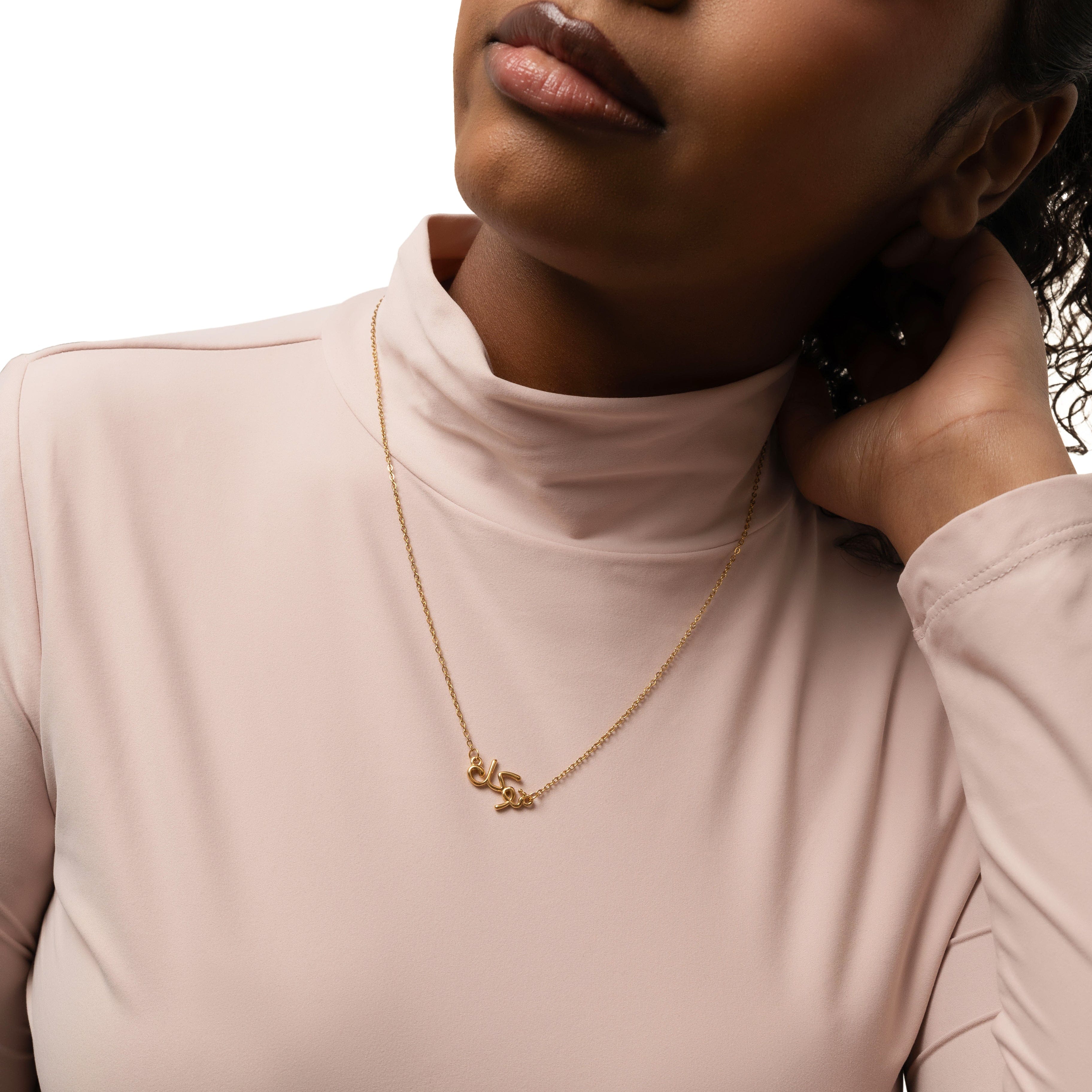 Model wearing the gold bubble necklace with Tawakkul, highlighting its elegant look.